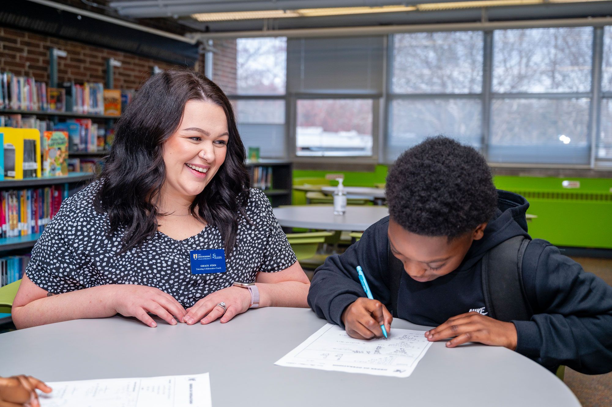 A tutor watching a student learn