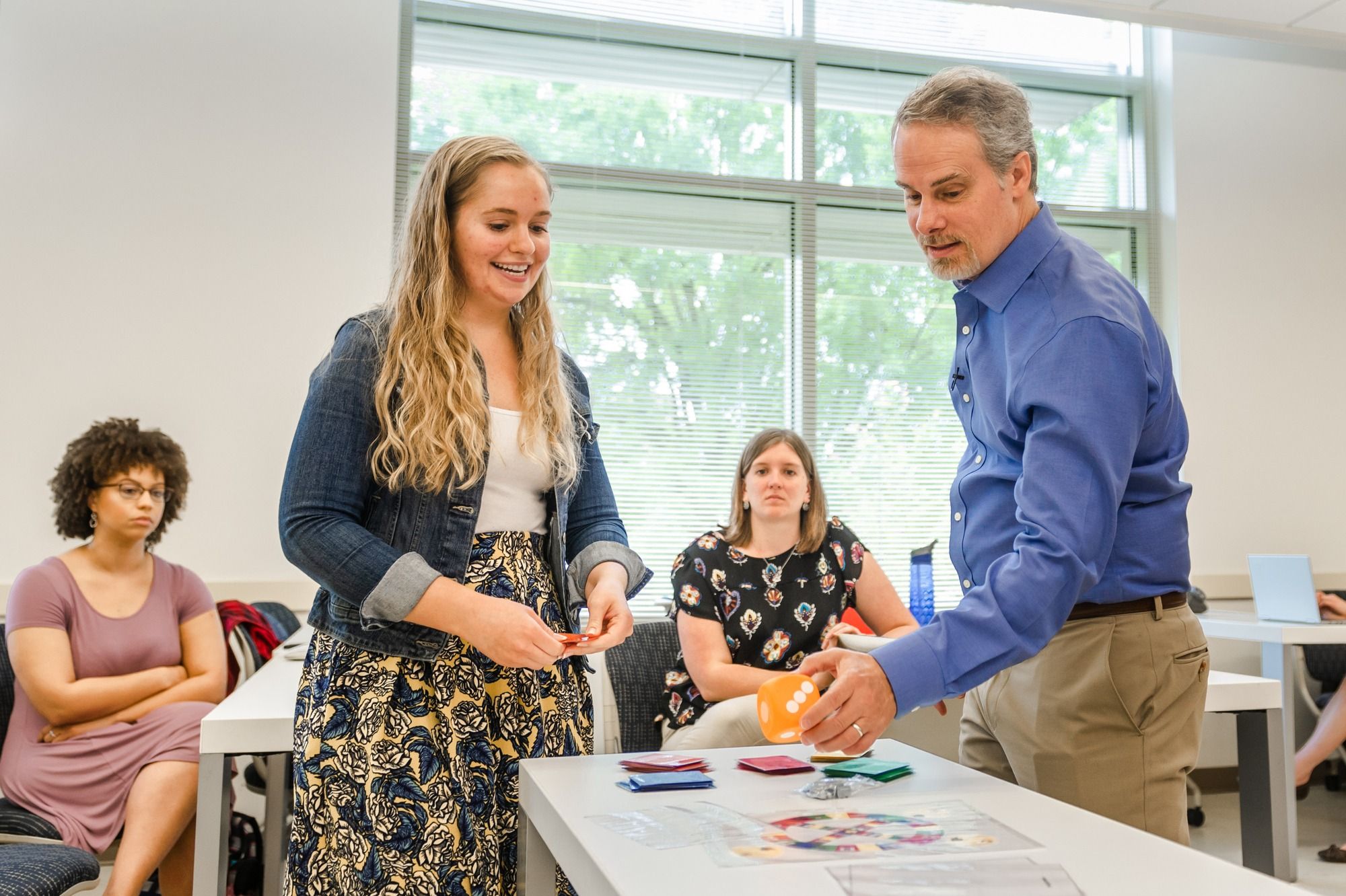 A professor teaching a hands-on lesson
