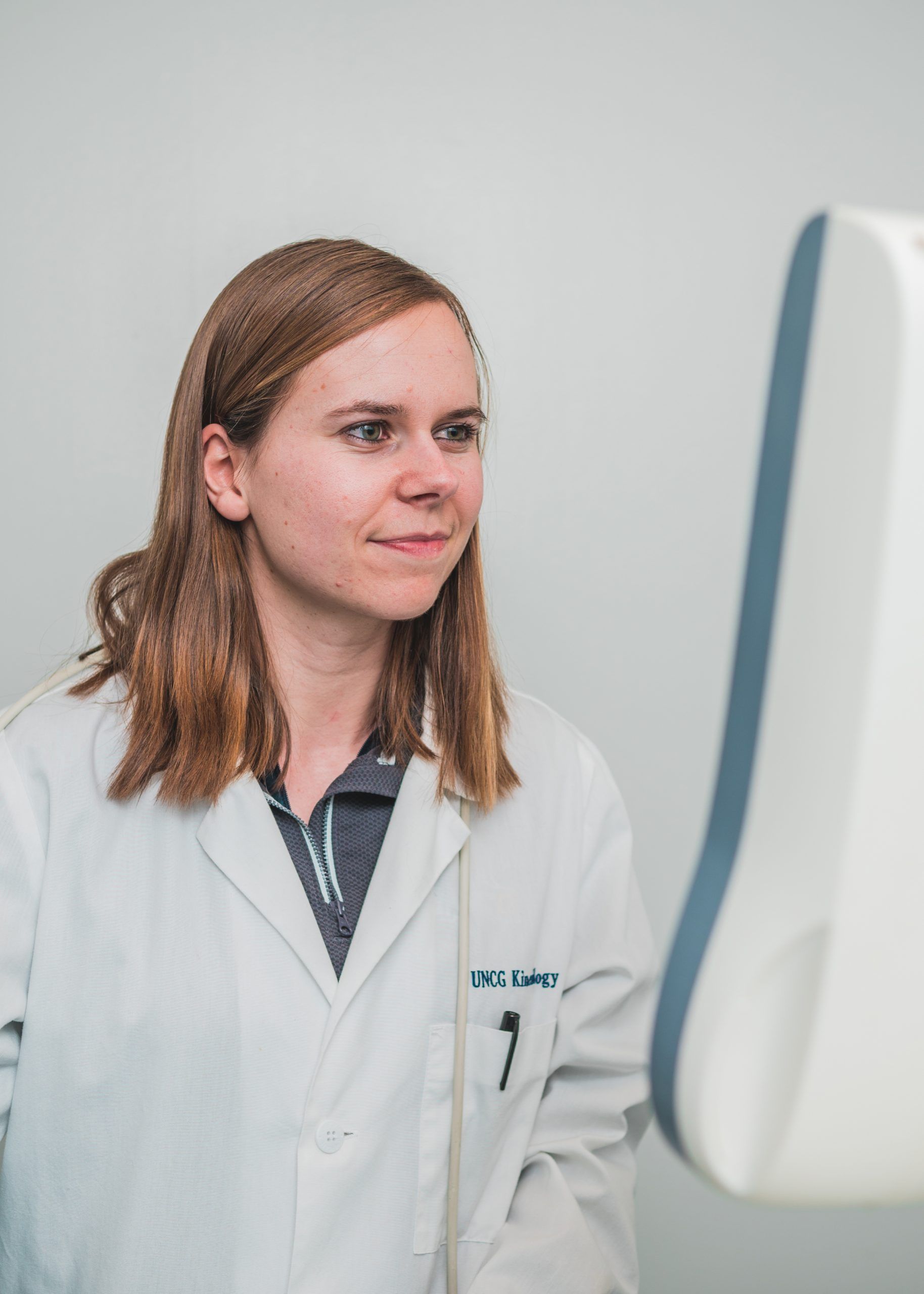 Grad student Louisa Tichy looking at a computer monitor