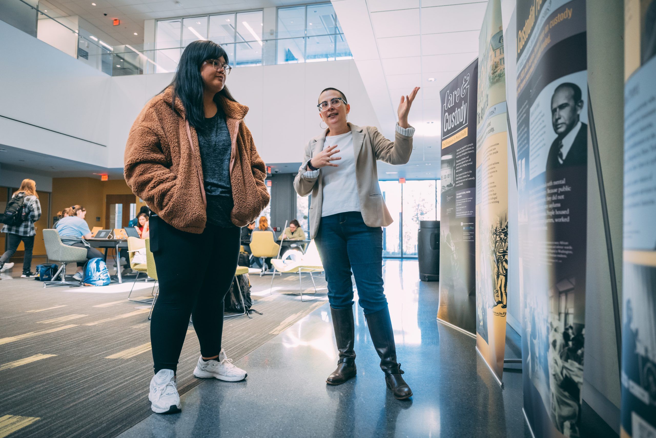 Parsons and grad student investigating her display