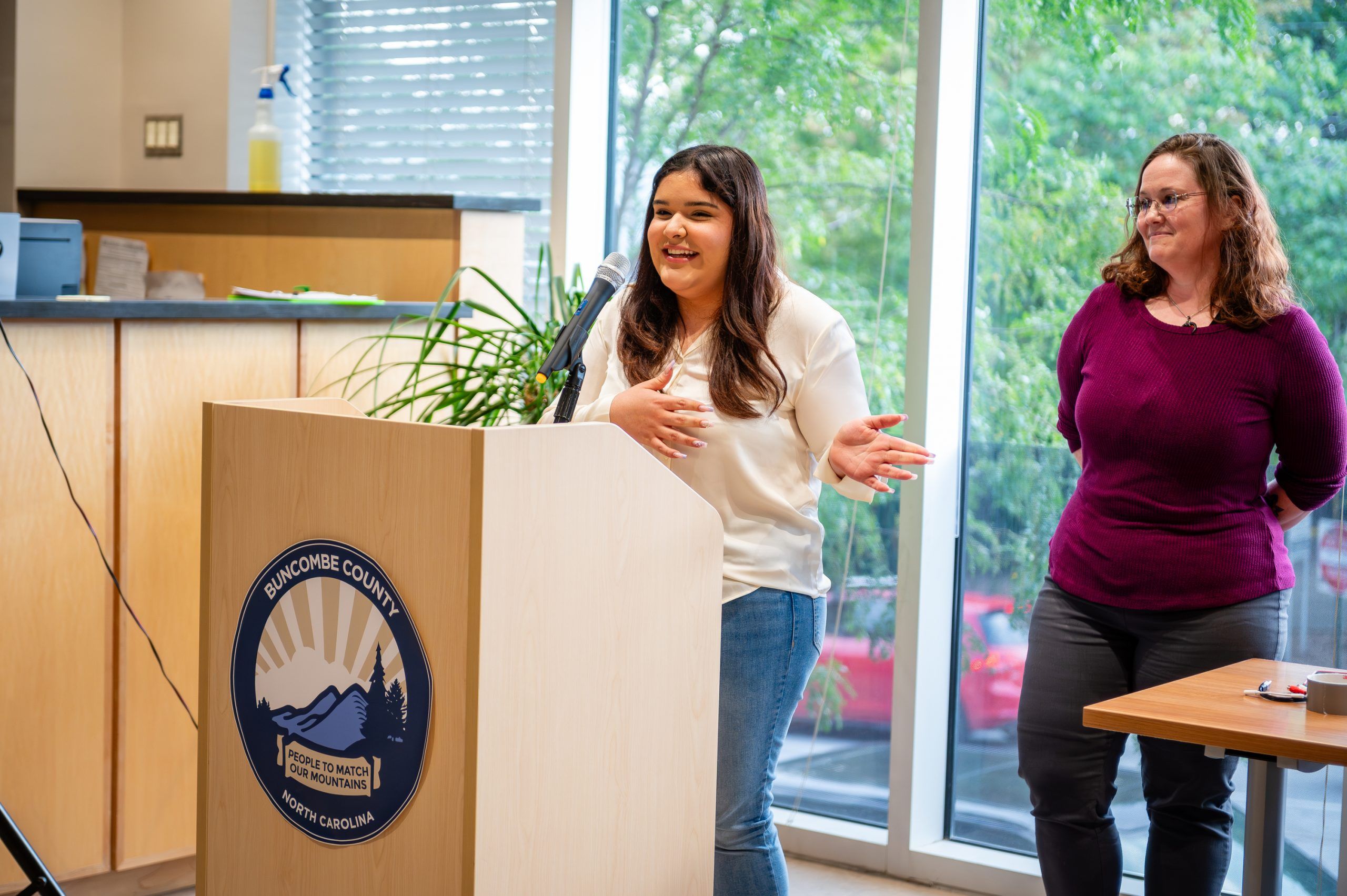 Student speaking at exhibit opening