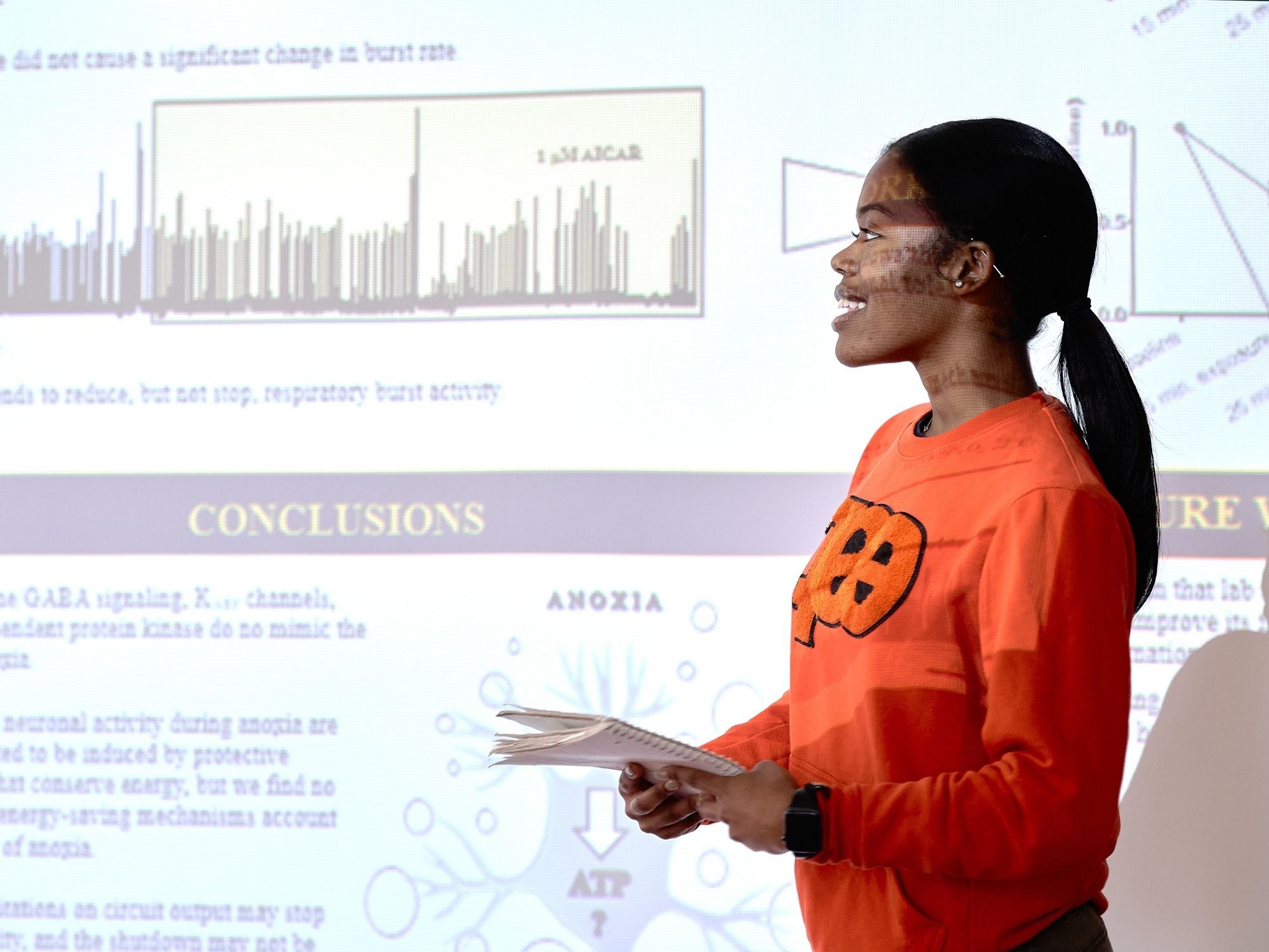An undergraduate researcher presents her work during a MARC U-STAR cohort meeting.