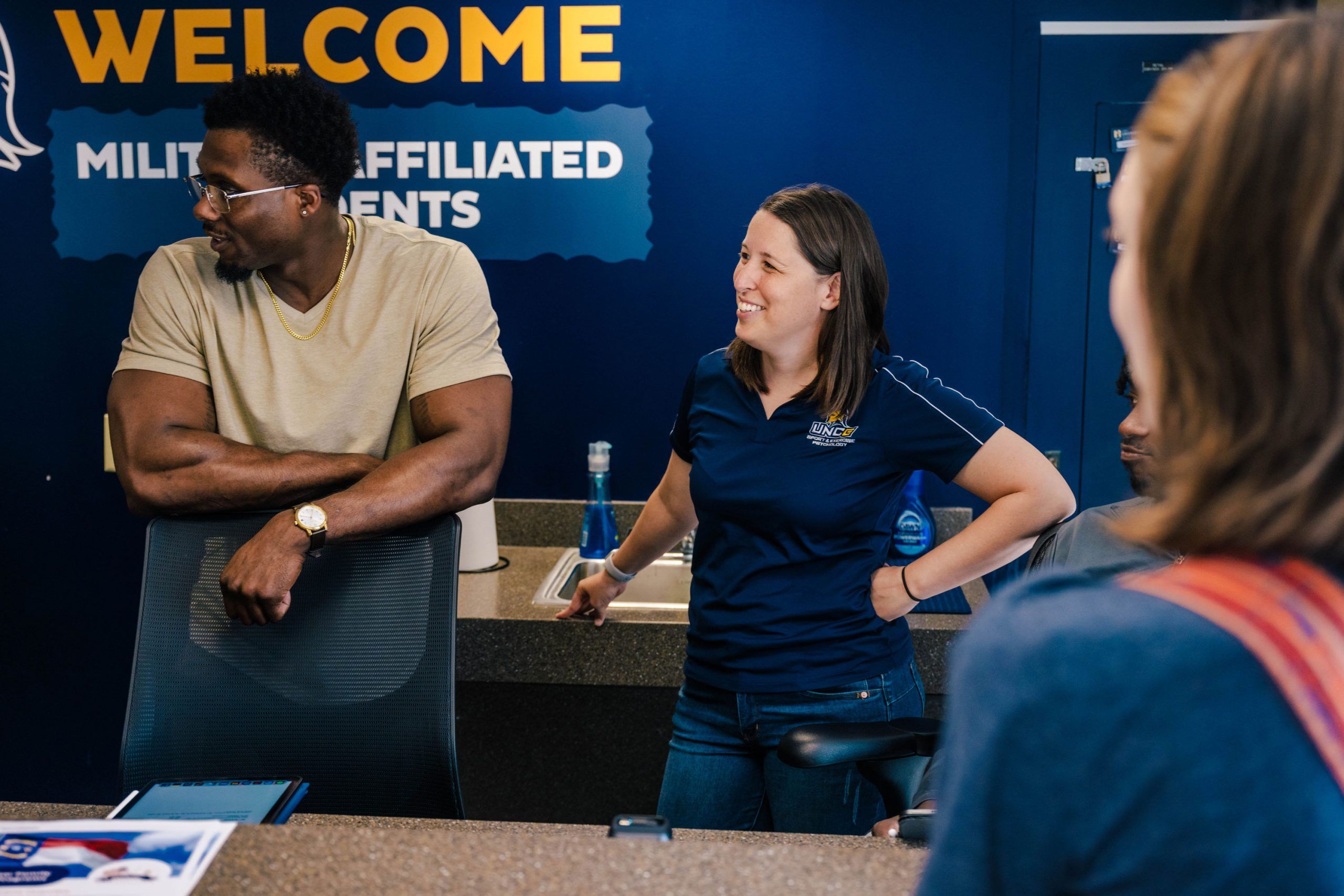 Wideman next to the Bod Pod, a machine that takes measurements of a child's body