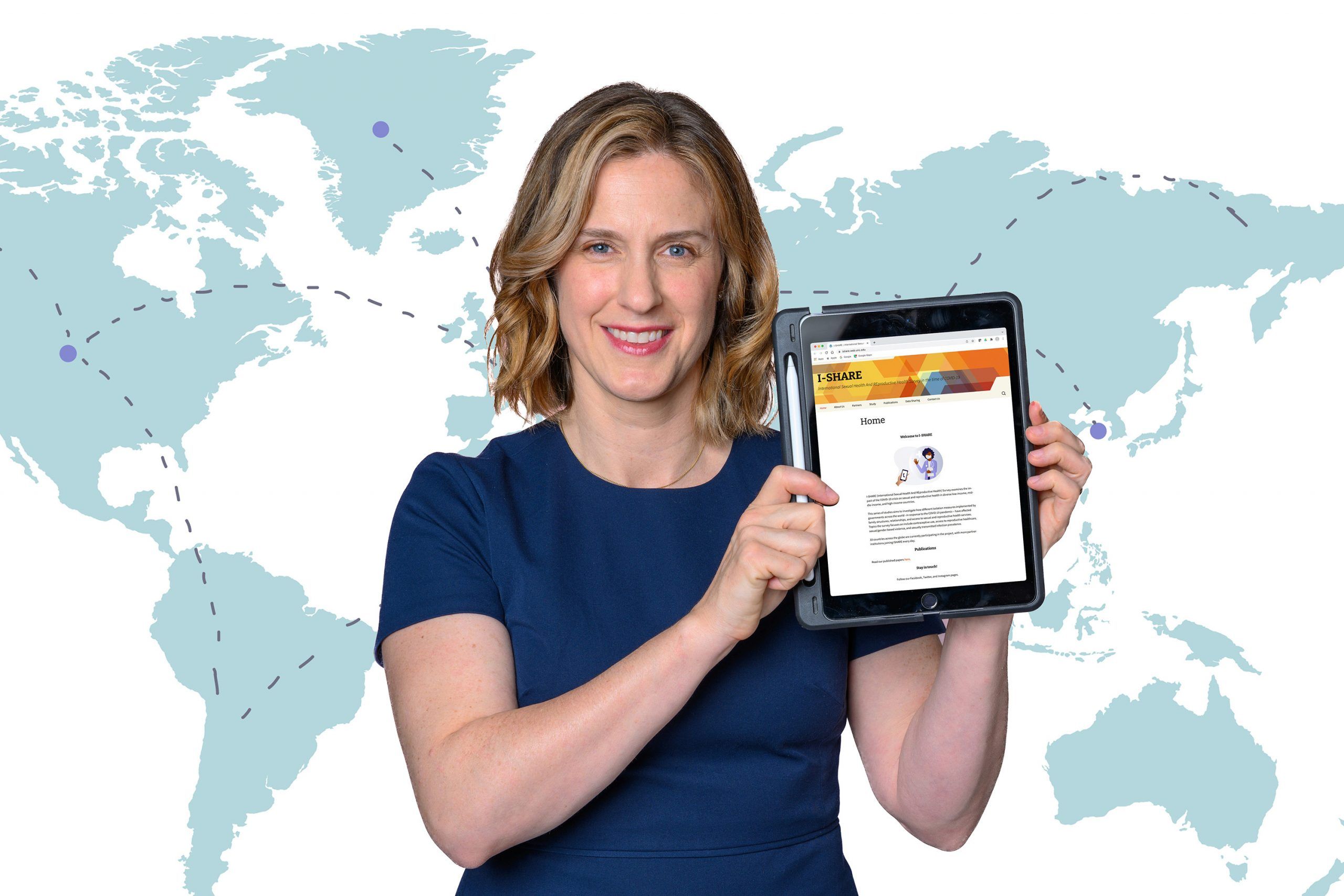 Dr. Erausquin holds up an iPad displaying the survey she worked on in collaboration with a team of international researchers.