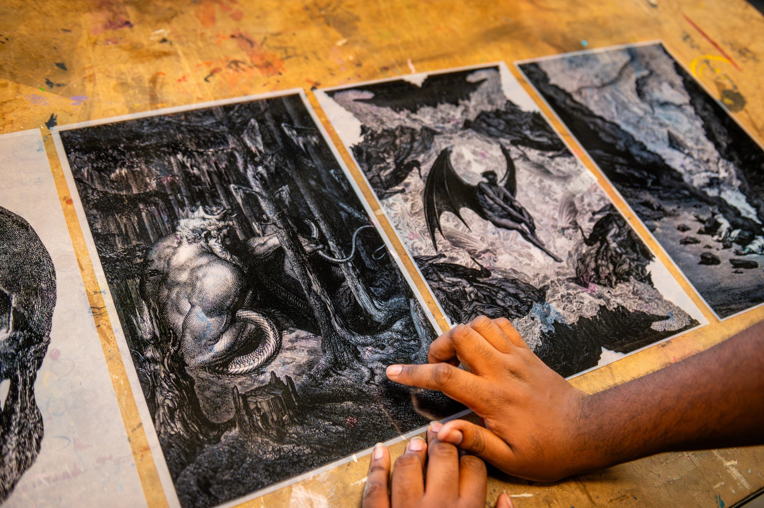 Miles-Moultrie pointing at one of his prints