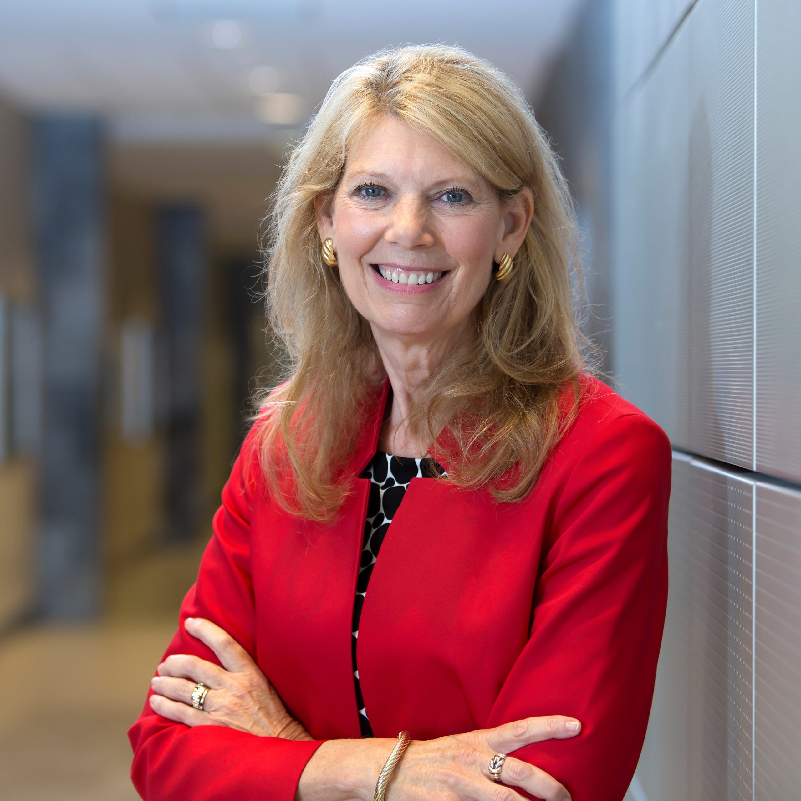 Headshot of Vice Chancellor of Research and Engagement, Terry Shelton wearing a red blazer.