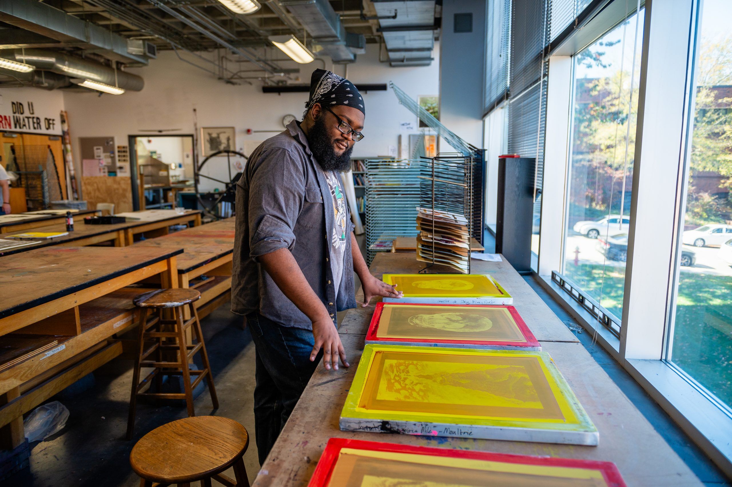 Miles-Moultrie looking at his prints