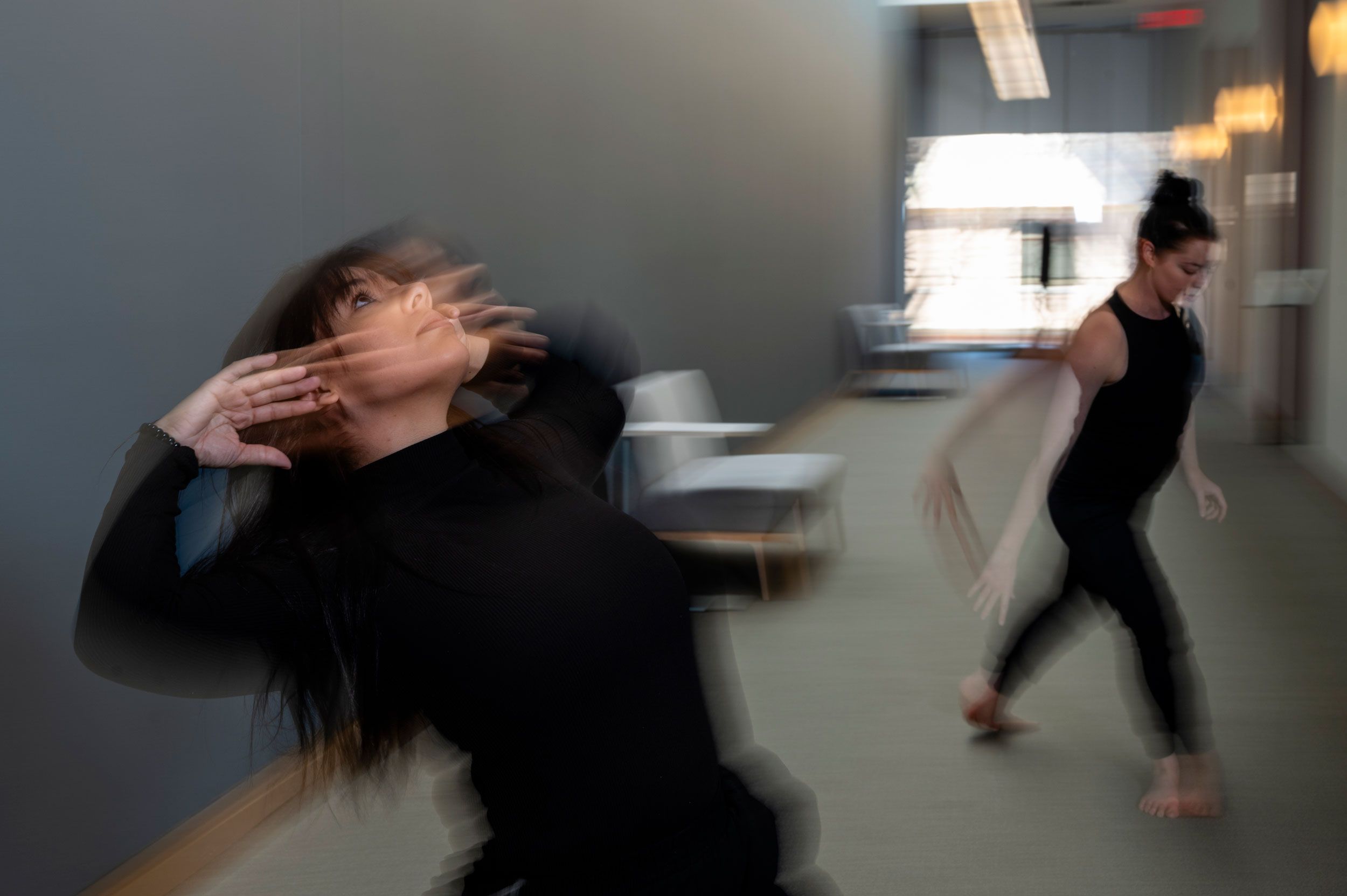 Liz Anderson and Tiffany Moss Hale dancing with motion blur