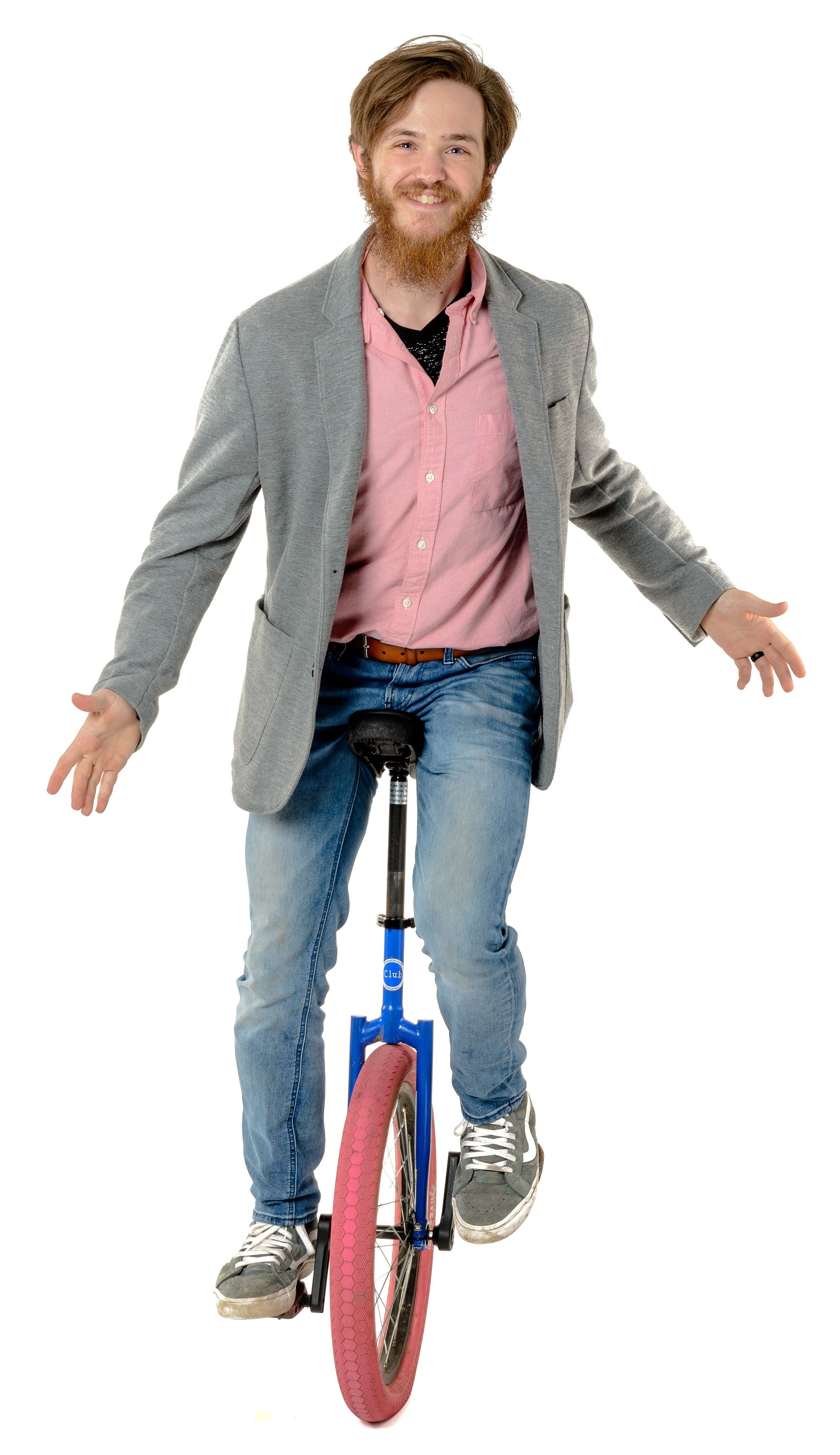 UNCG undergrad Aidan Lytle balances on a unicycle