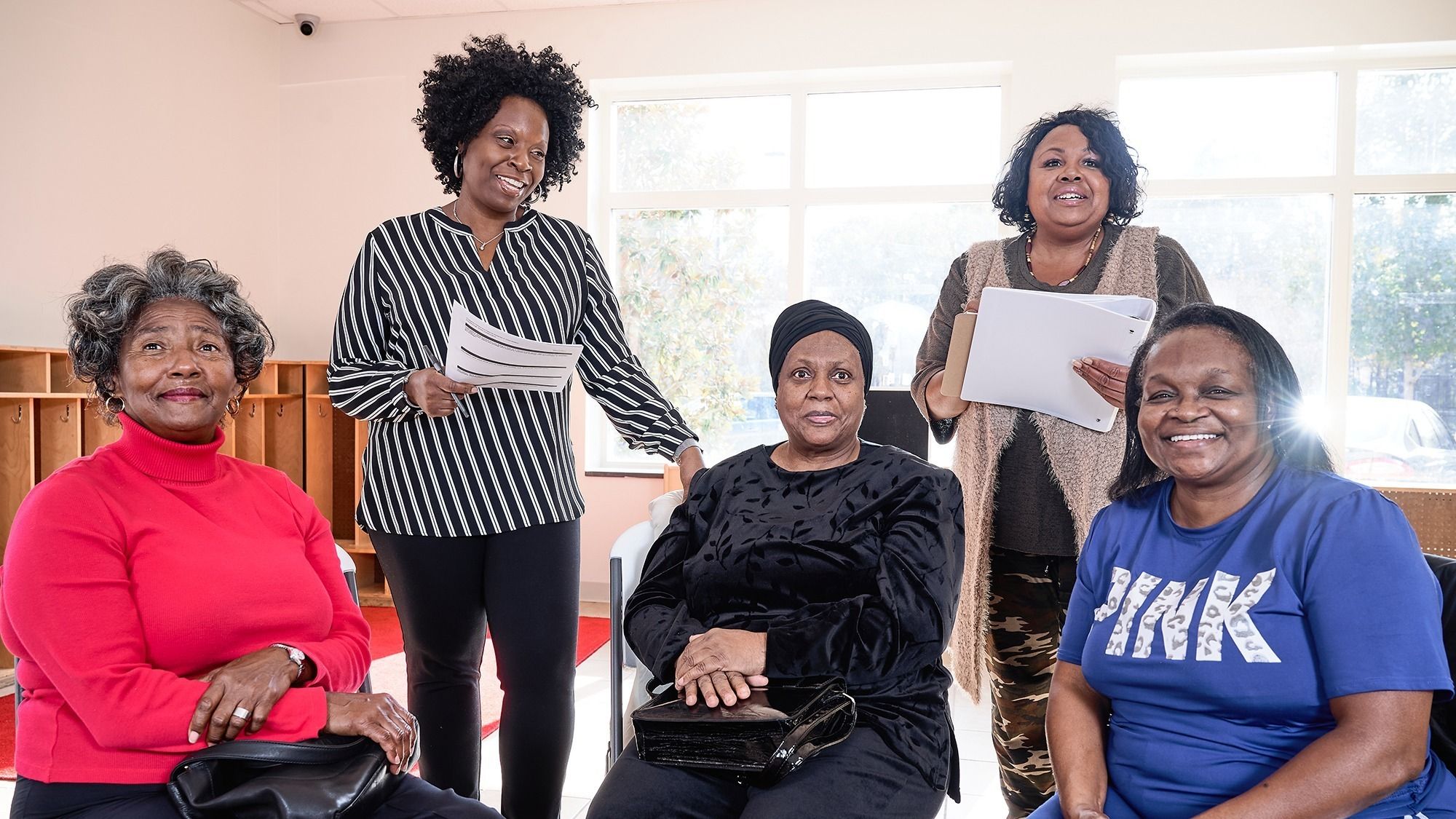 Dr. Washington speaks with a kinship care support group, along with group facilitator Lisa Taylor.