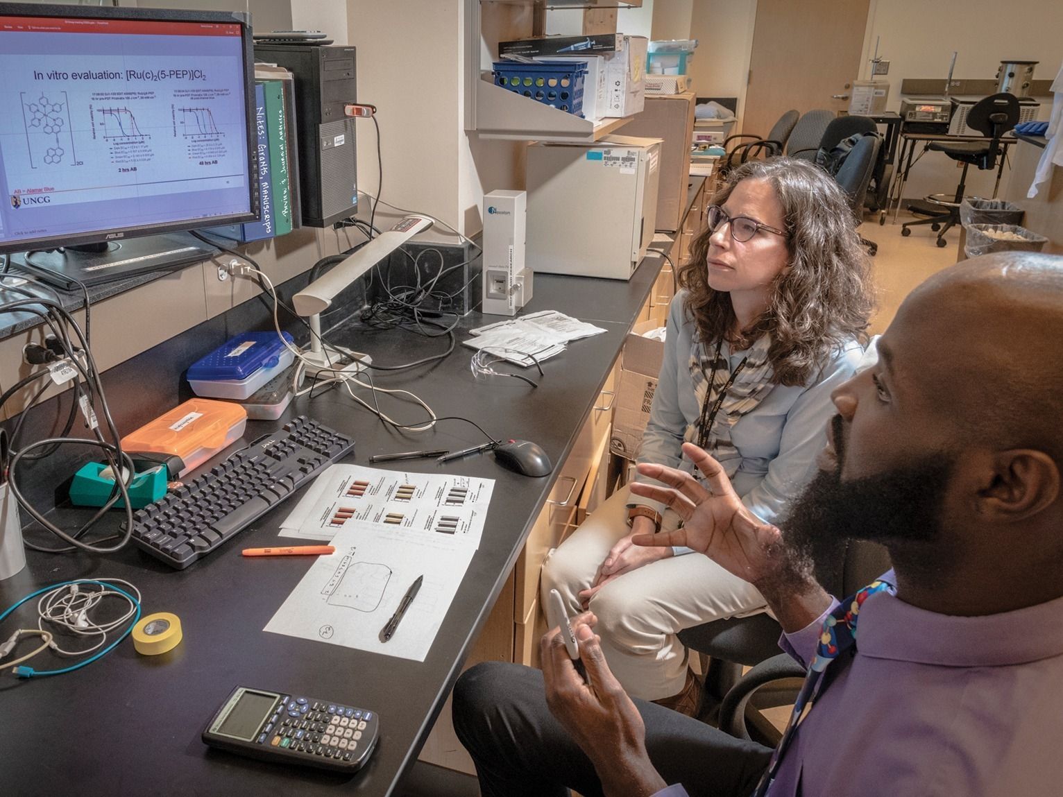 McFarland and a graduate student examining results
