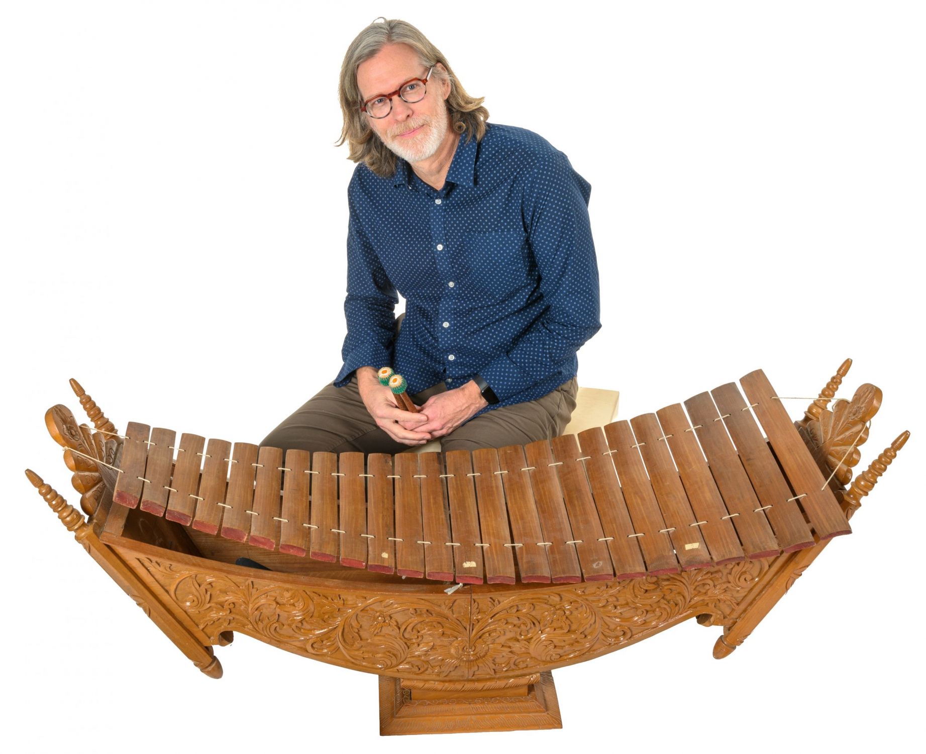 Dr. Gavin Douglas with a xylophone-like instrument called a pattala, made of teak wood and bamboo.