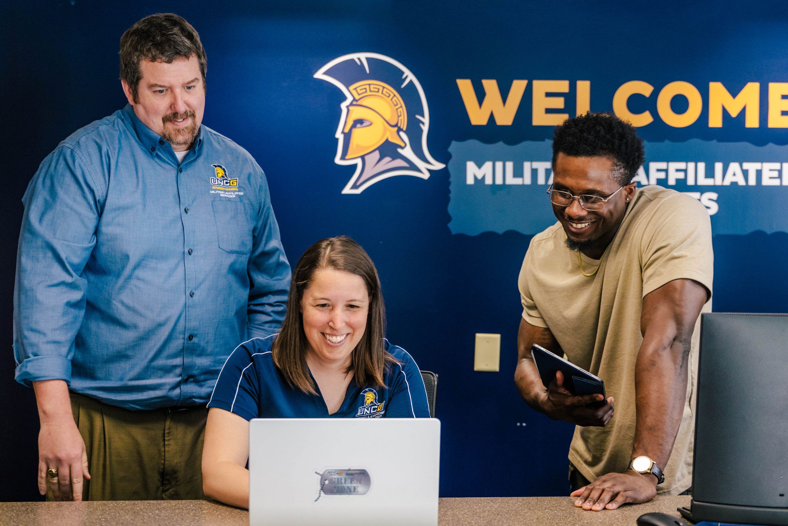 Wideman next to the Bod Pod, a machine that takes measurements of a child's body