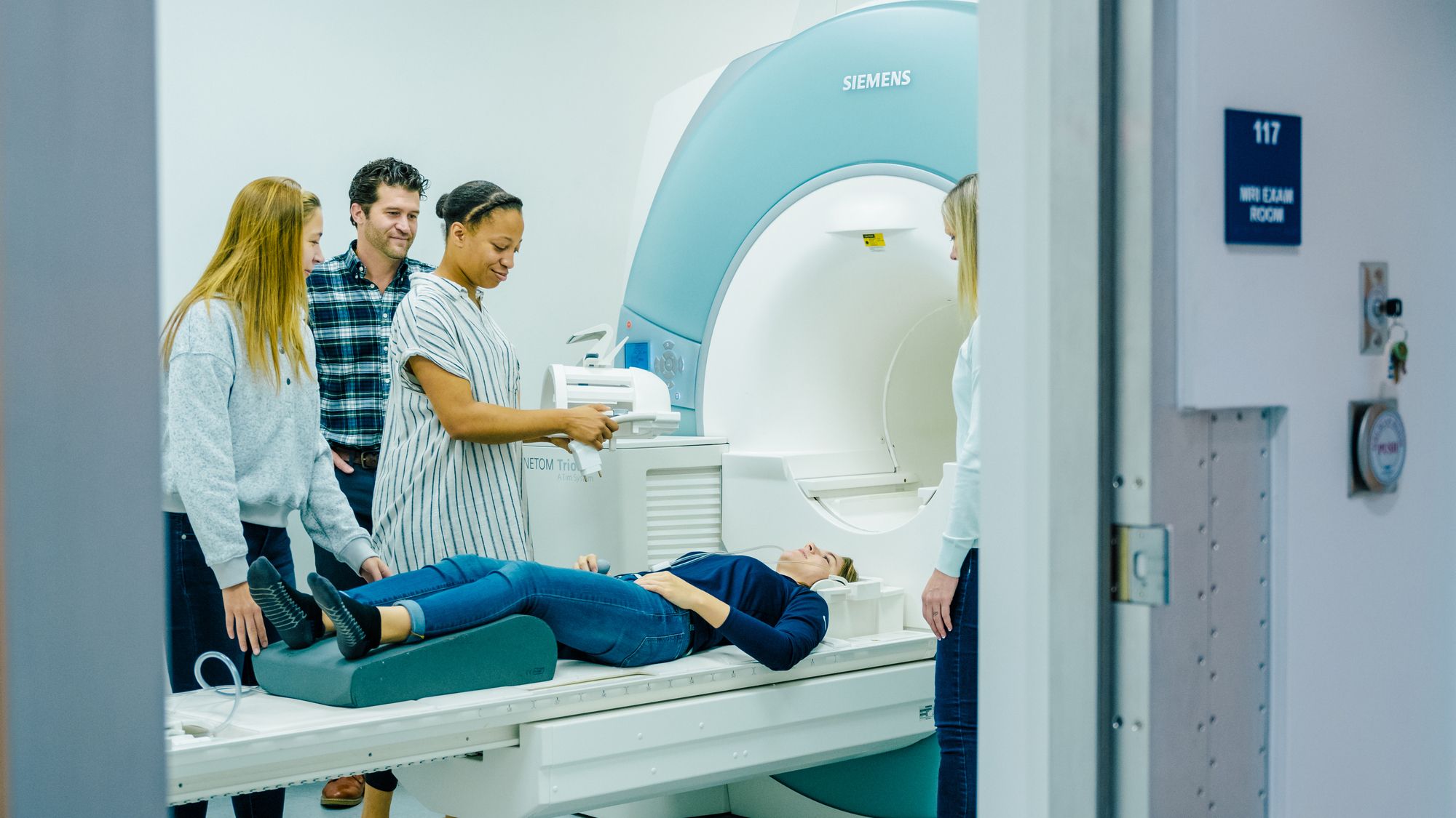 UNCG students using the MRI machine