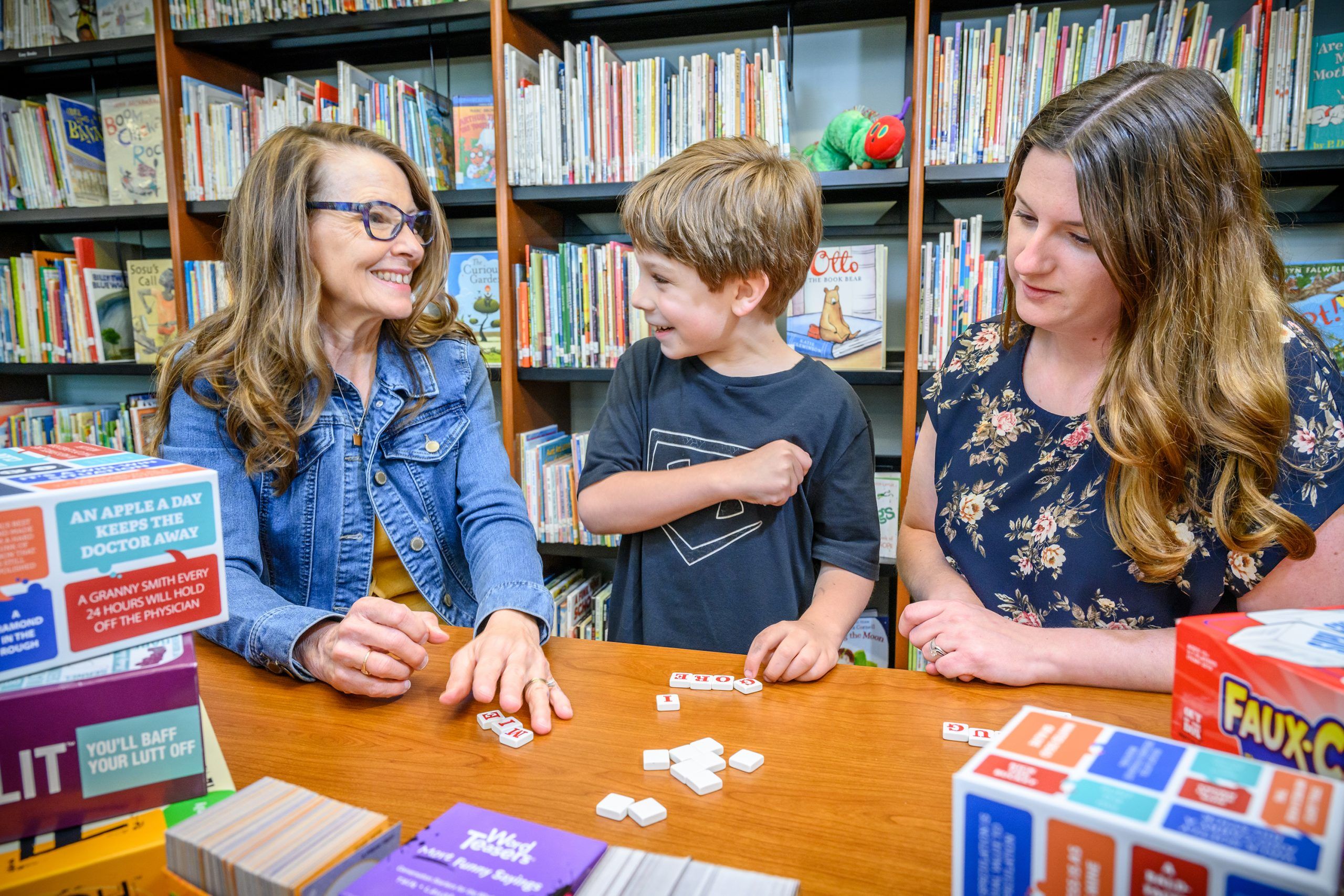 Cavanaugh and Ashley Gentry working with a little boy