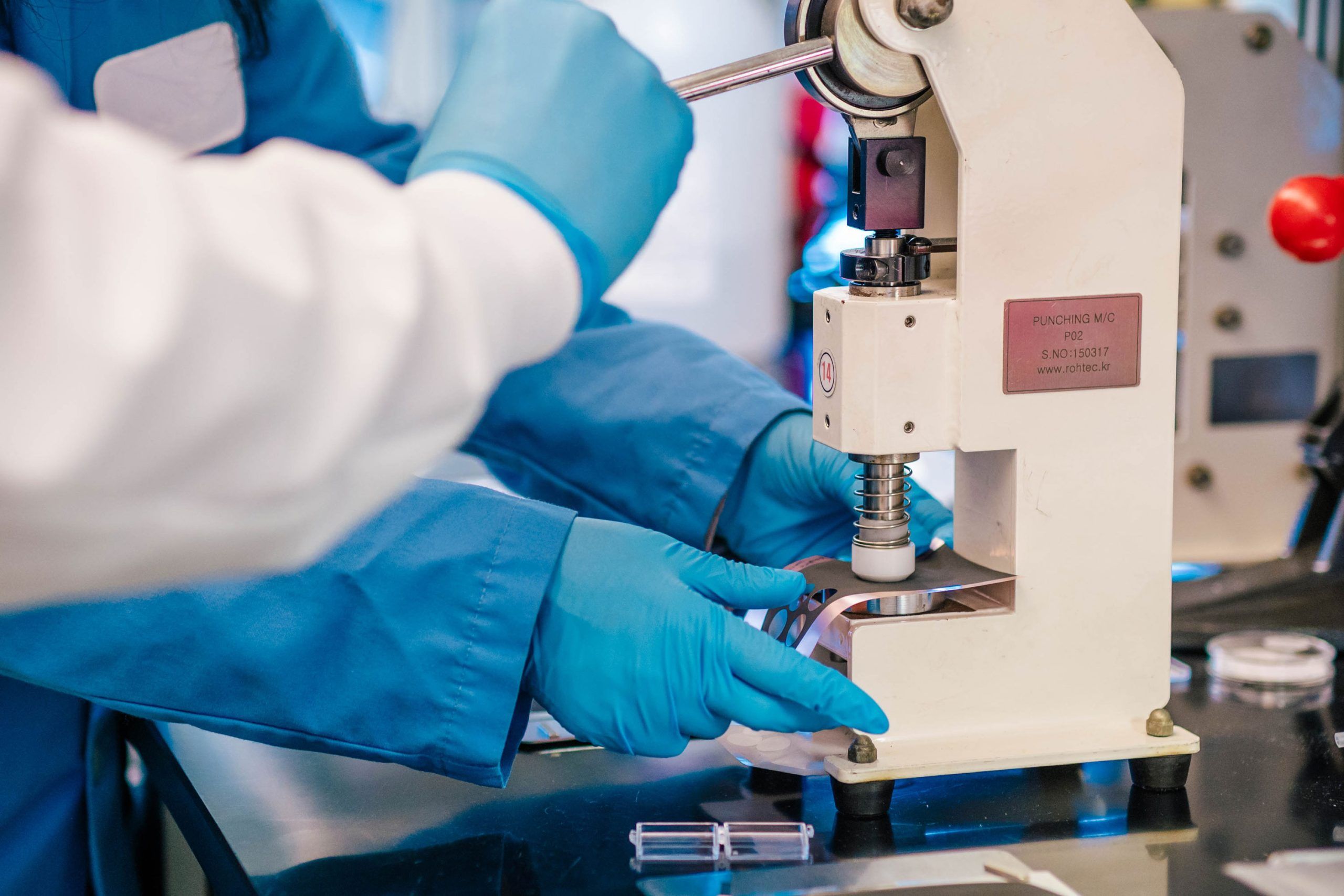 Wideman next to the Bod Pod, a machine that takes measurements of a child's body