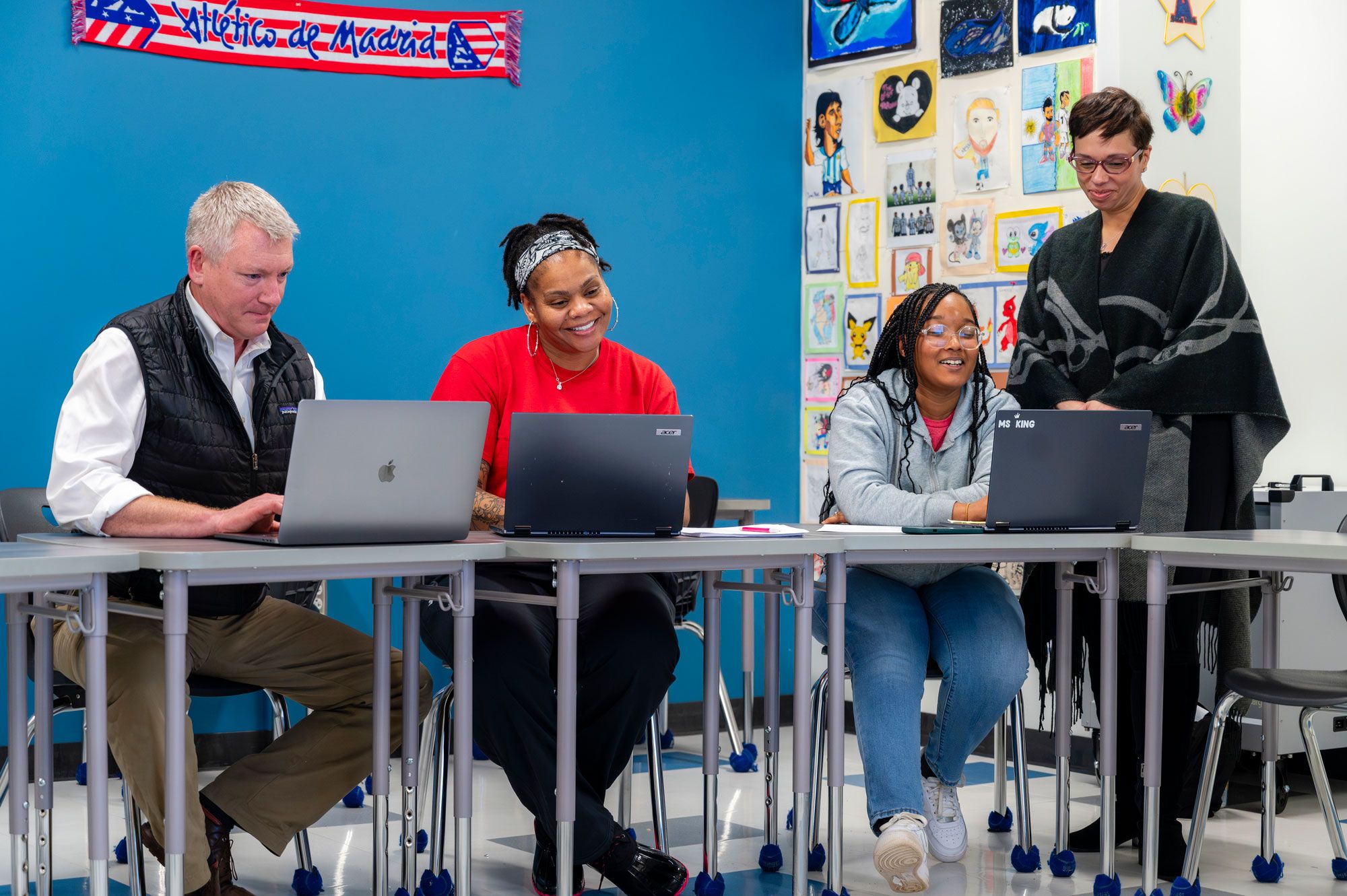 Teachers working at computers