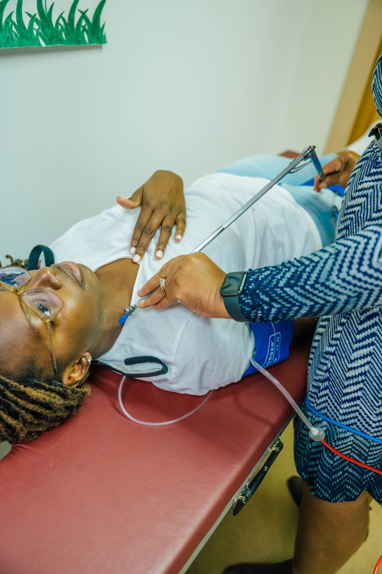 PhD student Favour Omondi while Dr. Avorgbedor uses a vicorder