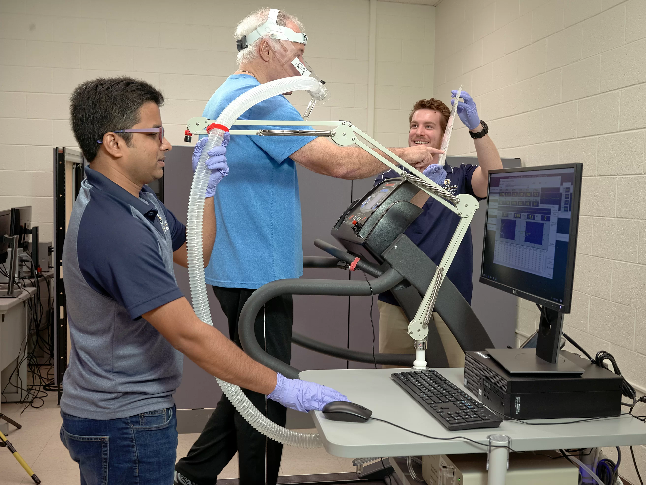 Researchers reading data on a computer