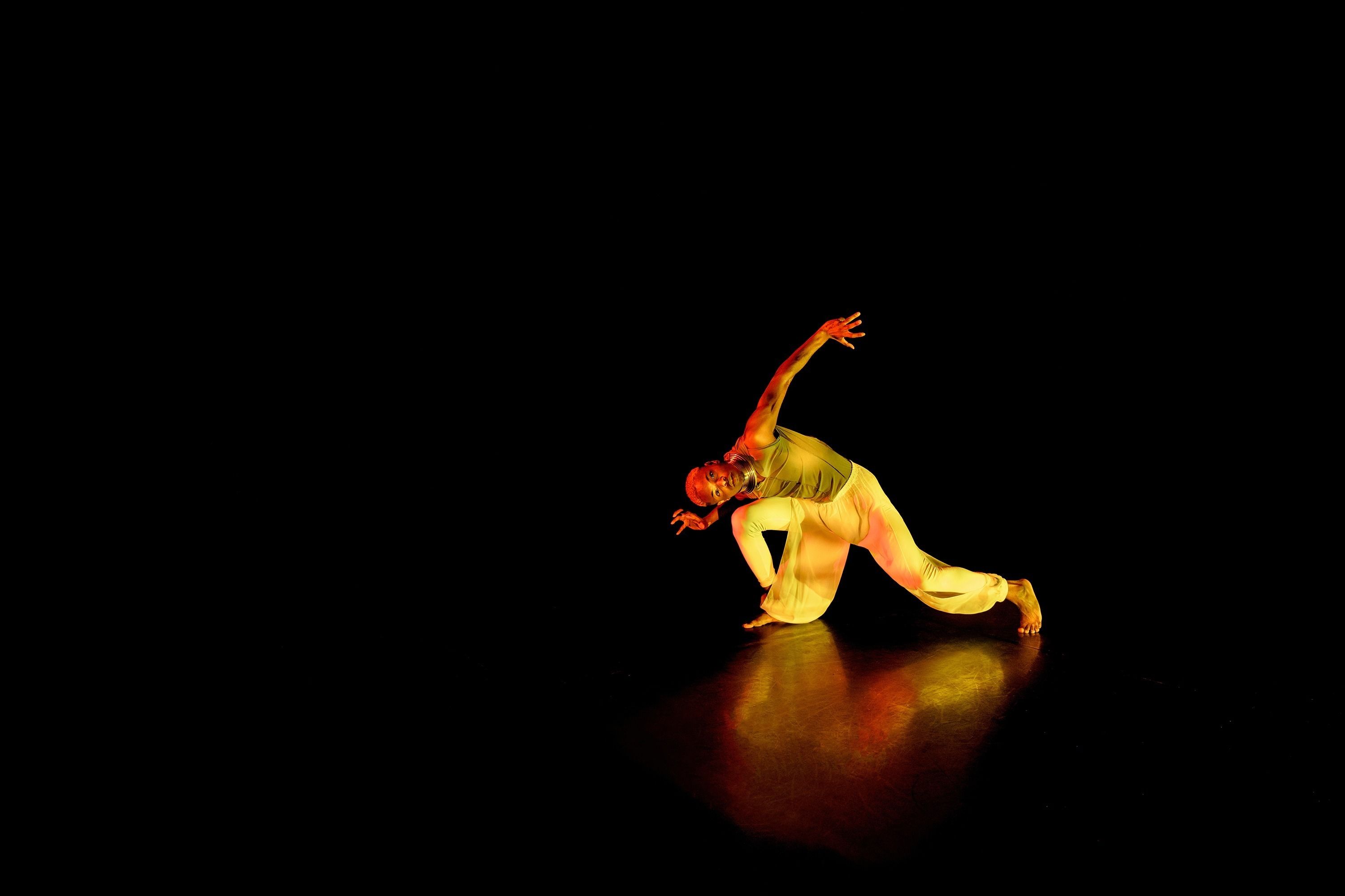 Hawkains with body contorted and kneeling