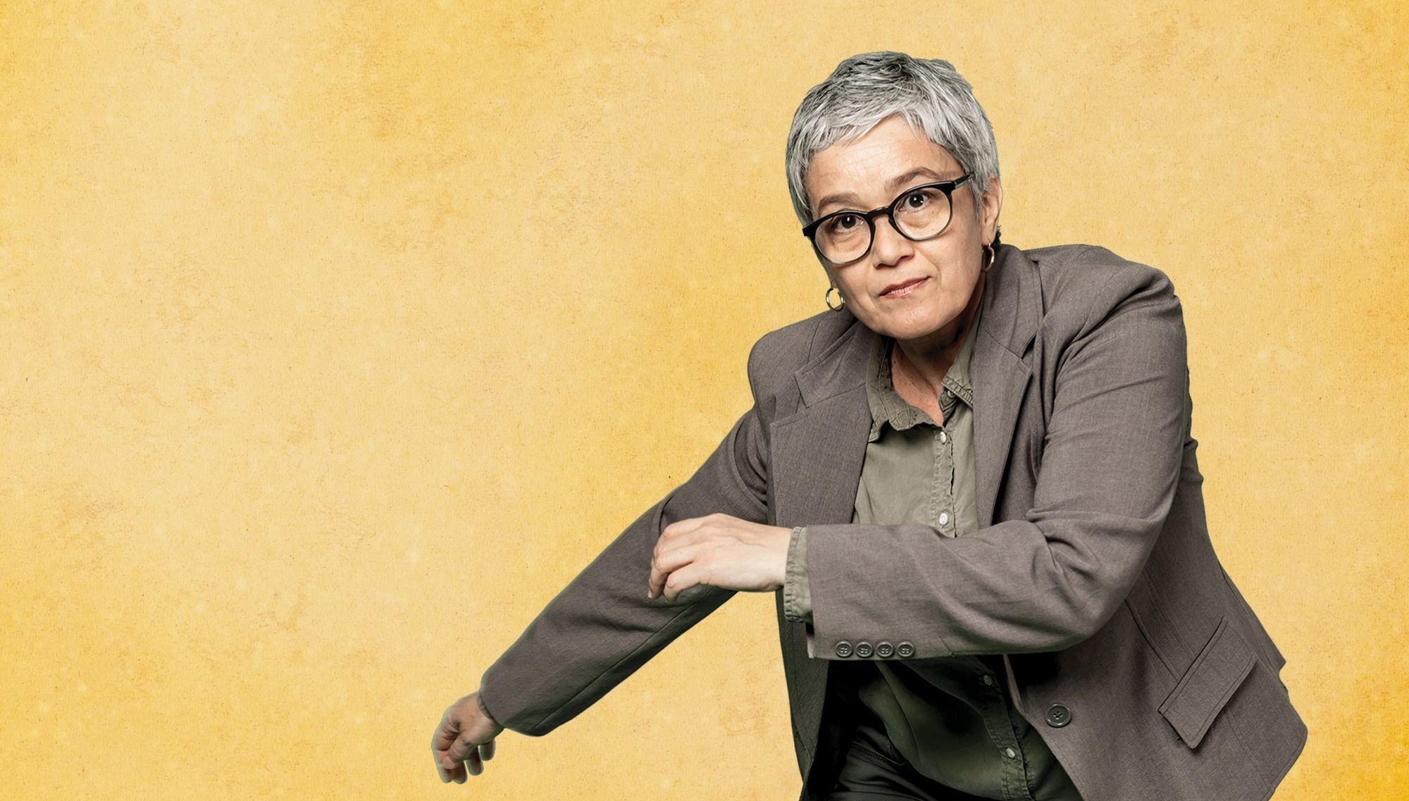 Dance researcher Ana Paula Hofling demonstrates a capoeira movement from one of her primary sources.