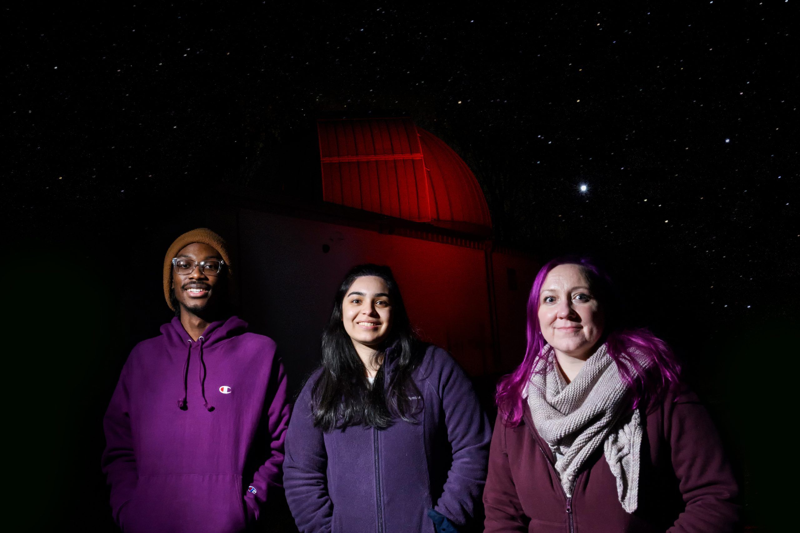Dr. Aarnio with undergrads Kamara Culbreath and Mariann Juarez standing in the Three College Observatory.