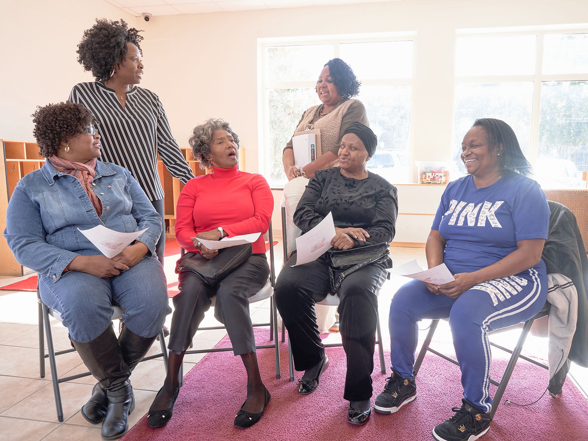 Dr. Washington and facilitator Lisa Taylor meet with a kinship caregiver group.