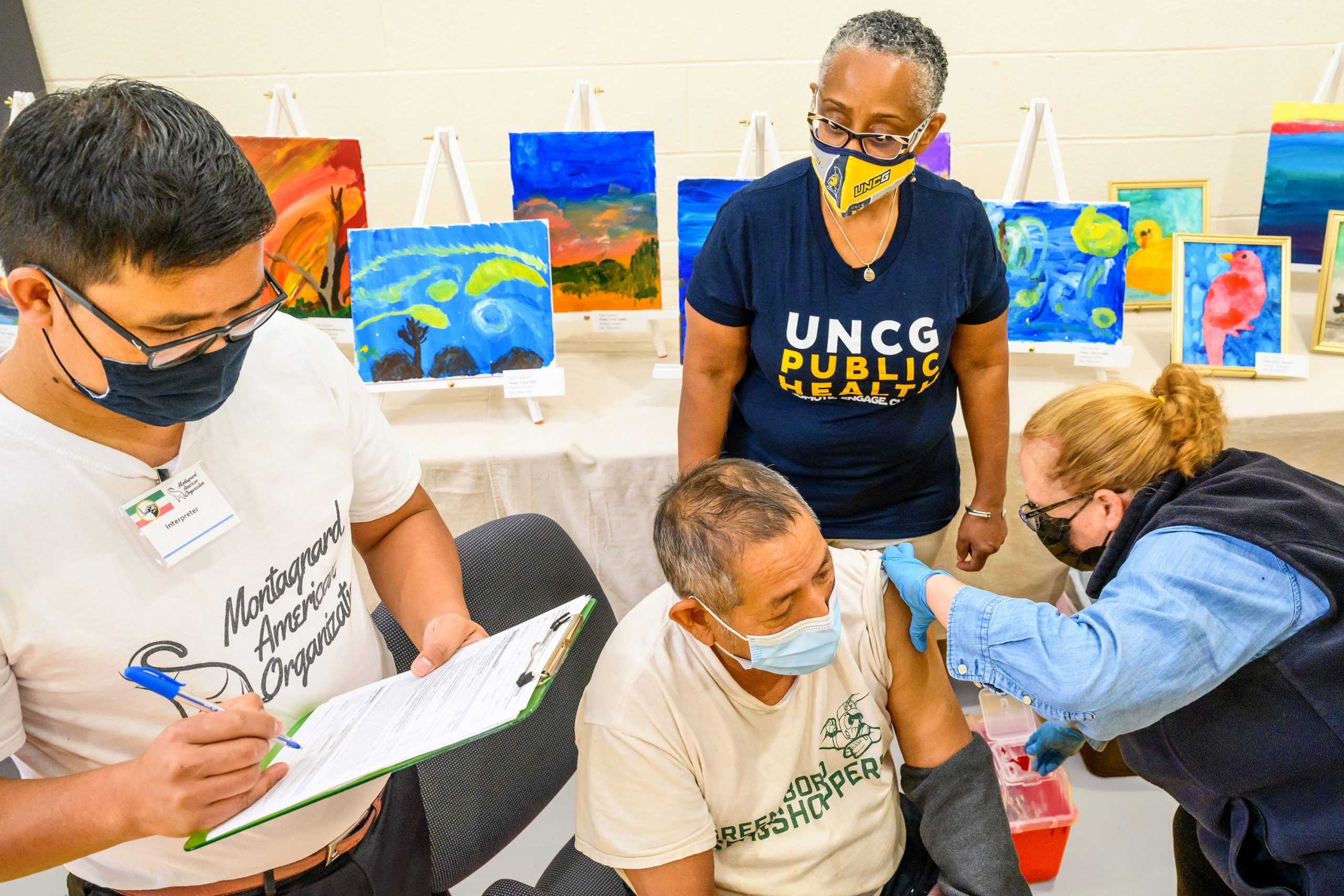 Xuem Siu and Dr. Morrison assist at a local vaccine clinic. 