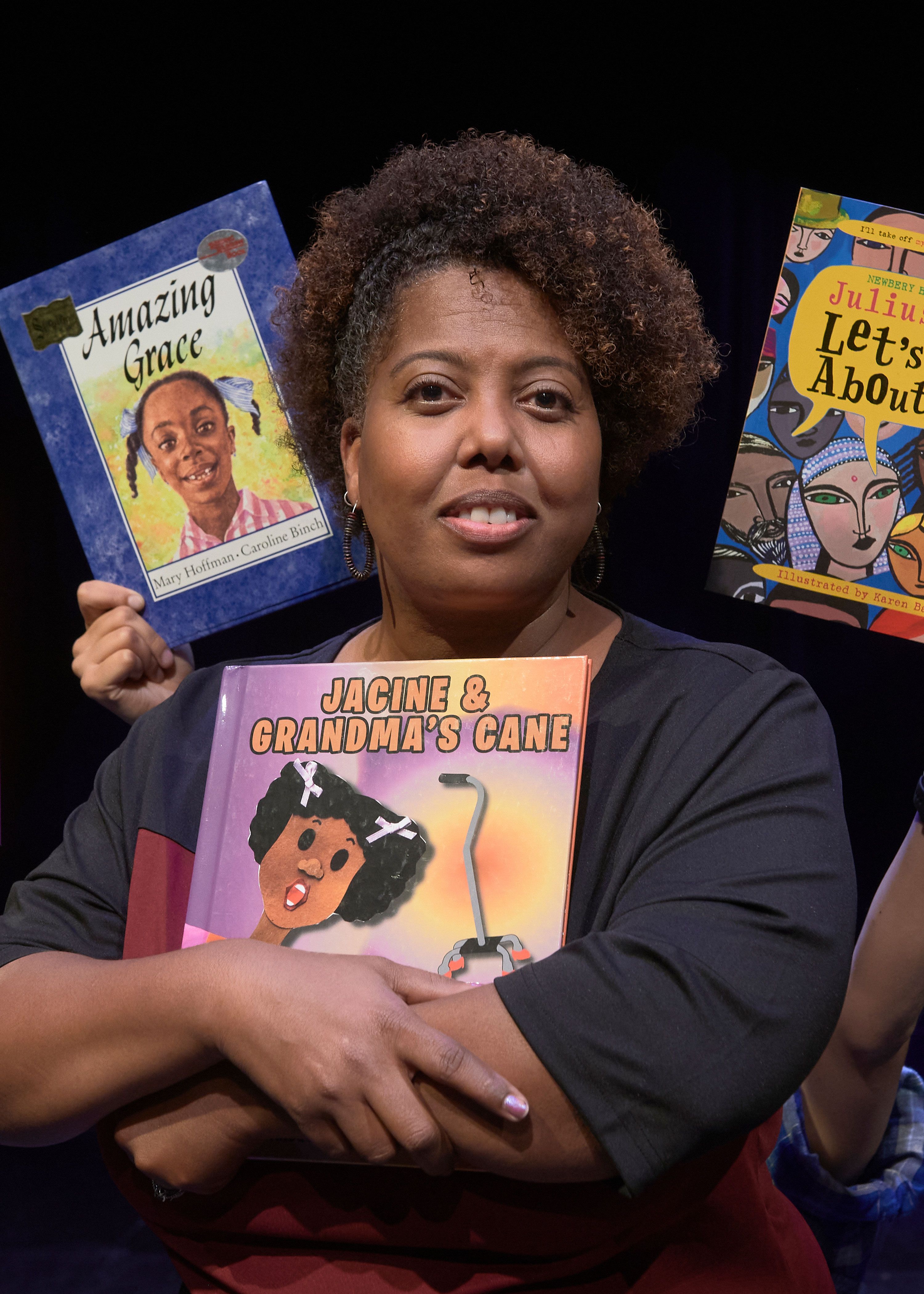 Natalie Sowell with books centering people of color