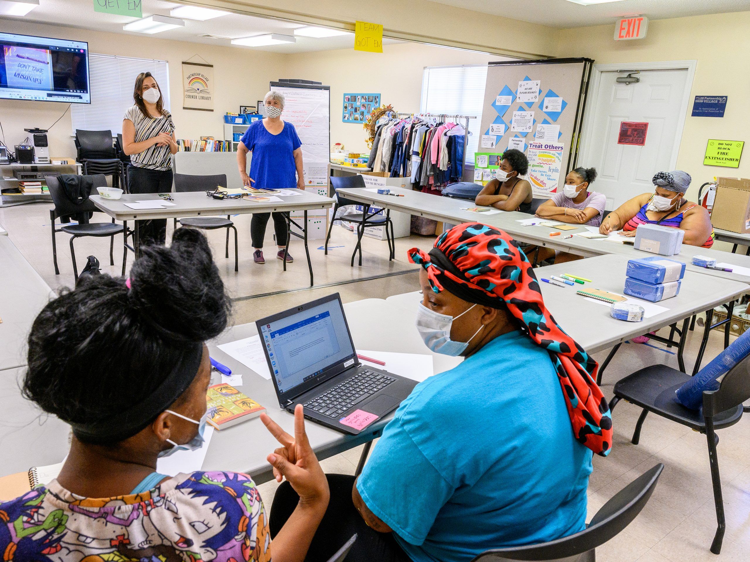 A group of people engage in a learning circle led by Dr. Cristiane Damasceno and community partner Beth Sheffield