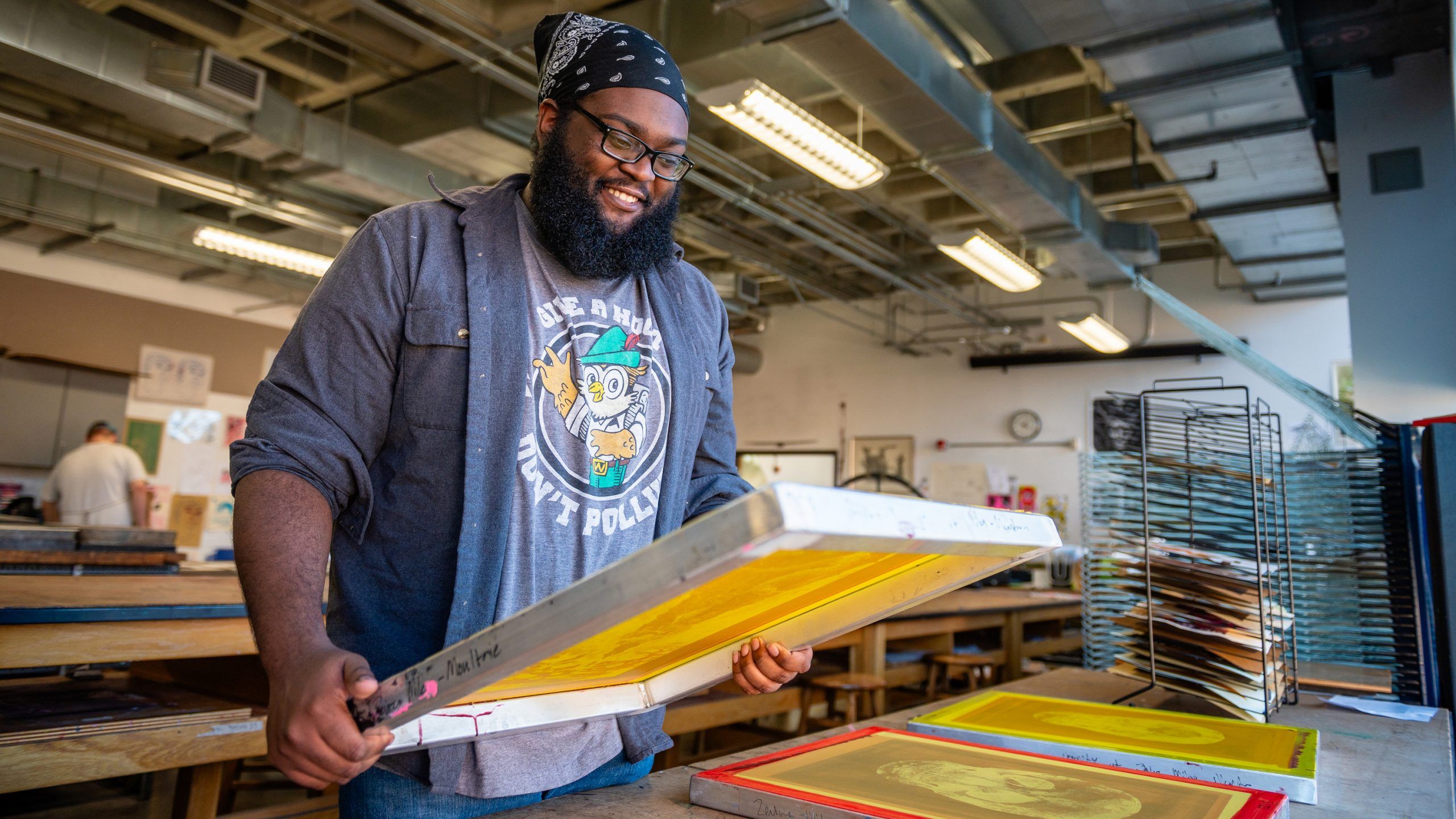 Zaire Miles-Moultrie checking one of his prints at Gatewood Print Studio
