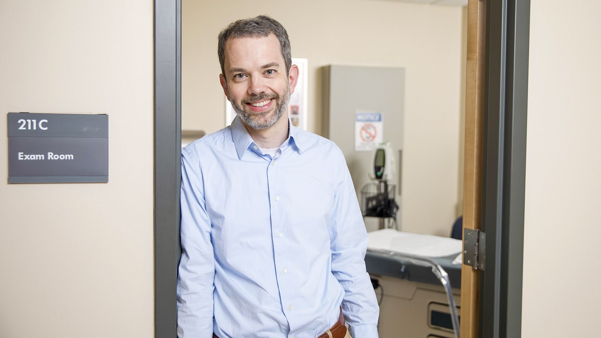 Dr. Andersen standing in the doorway of an exam room. 