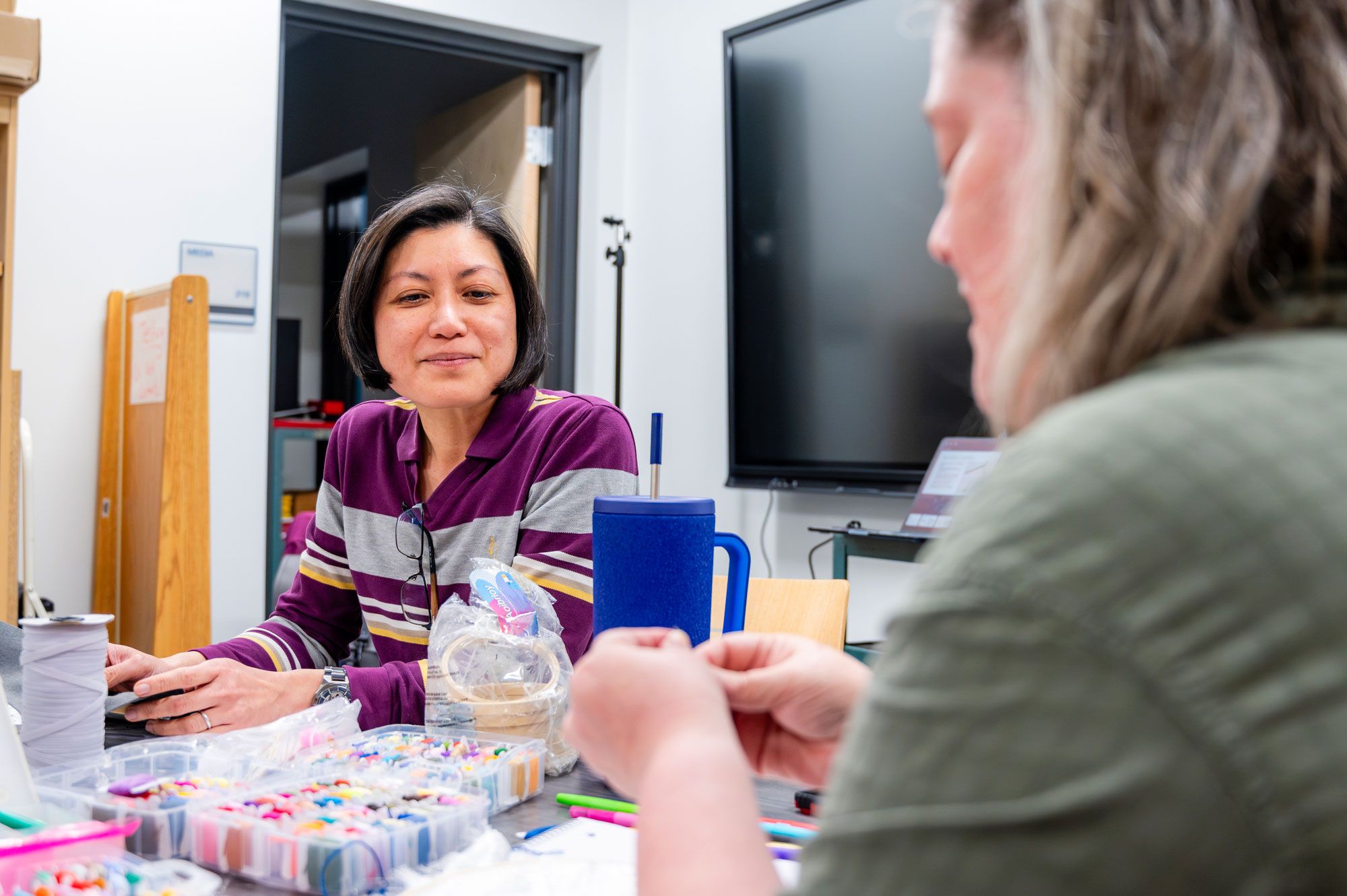 Teachers practicing with STEM manipulatives