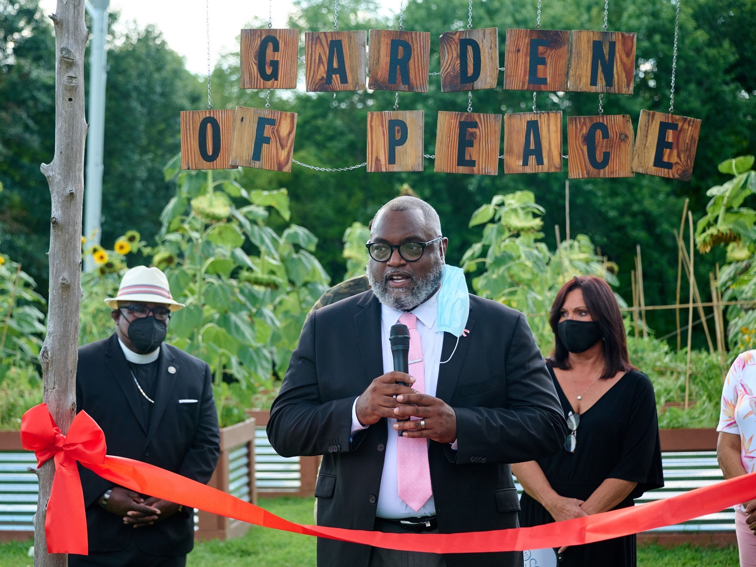 A speaker at the Garden of Peace ribbon cutting event.