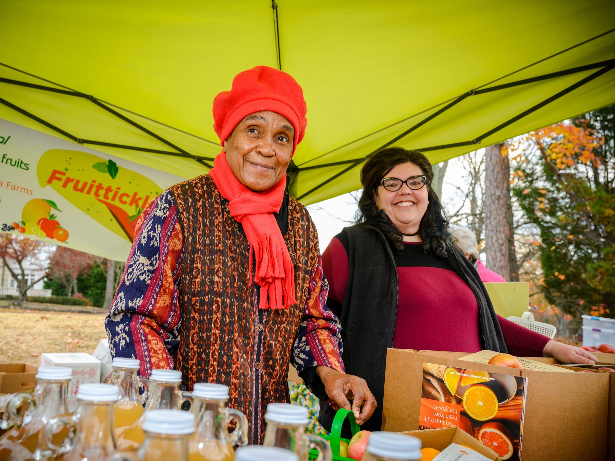 Dr. Marianne LeGreco and a vendor and her wares at one of the neighborhood markets.