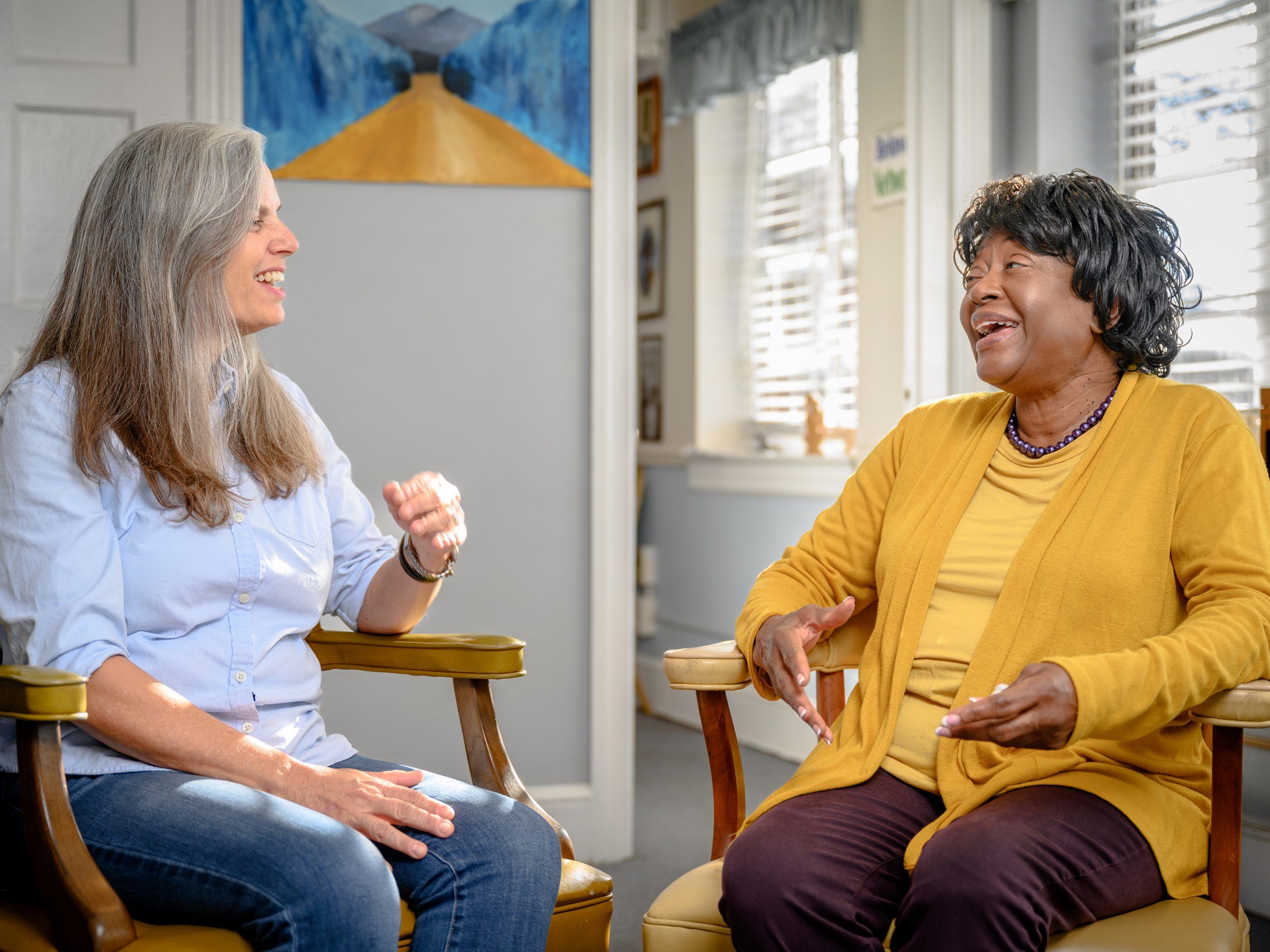 Dr. Spoma Jovanovic and Joyce Johnson sit in discussion at the Beloved Community Center.