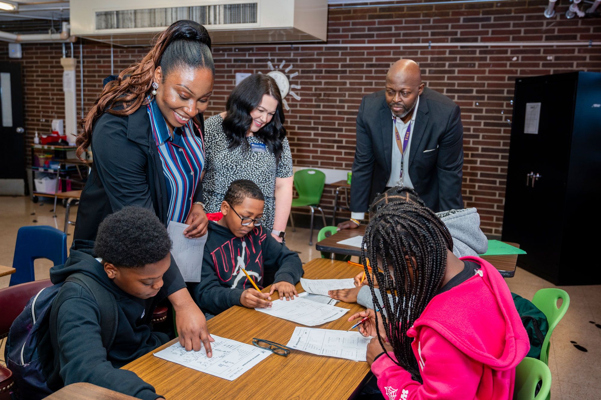 A teacher working with a small group of students