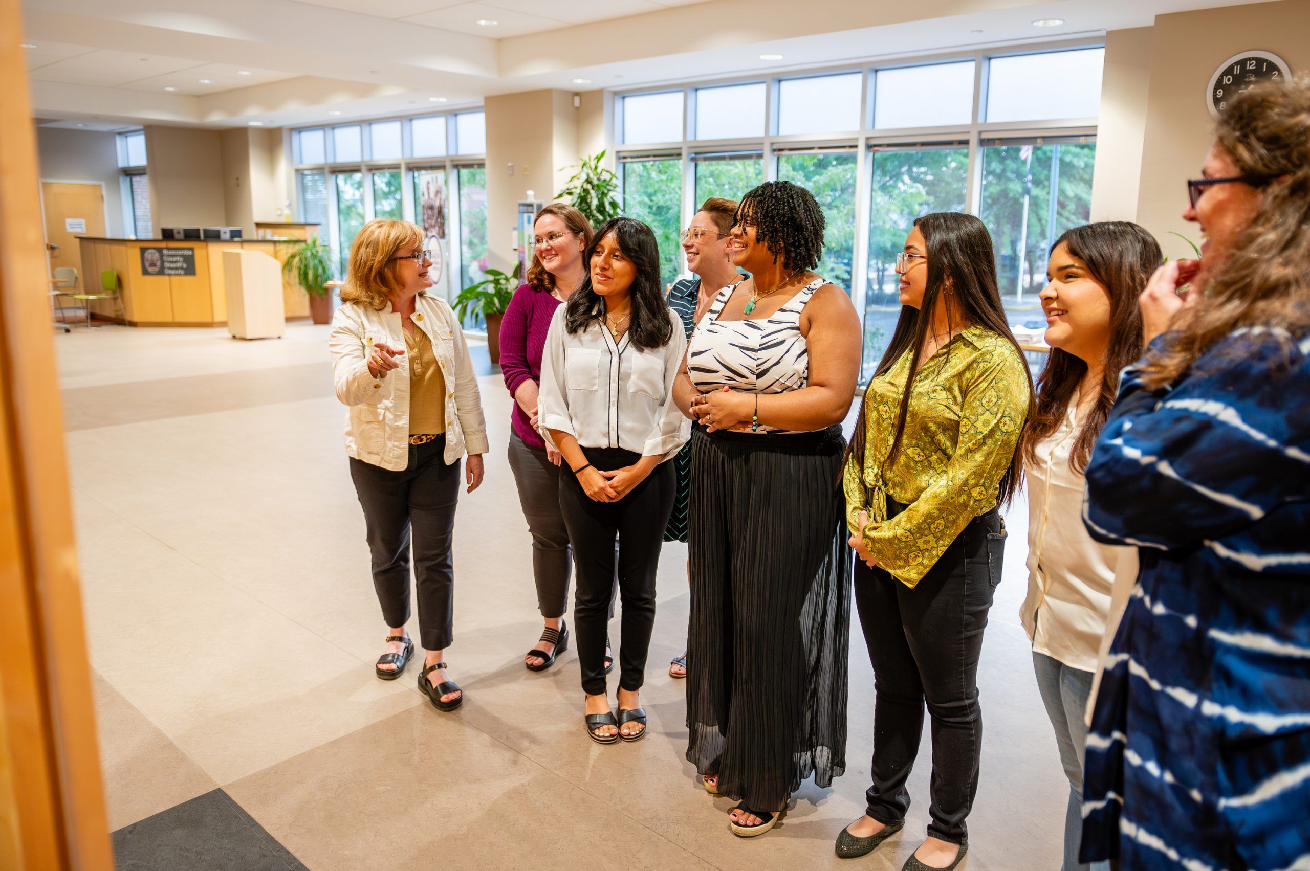 Viewers speaking about a piece in the exhibit