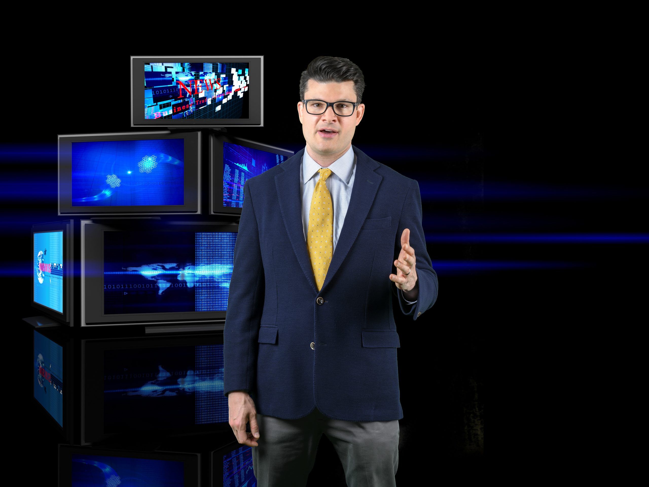 UNCG professor Dr. Chris Wahlheim infront of four TVS