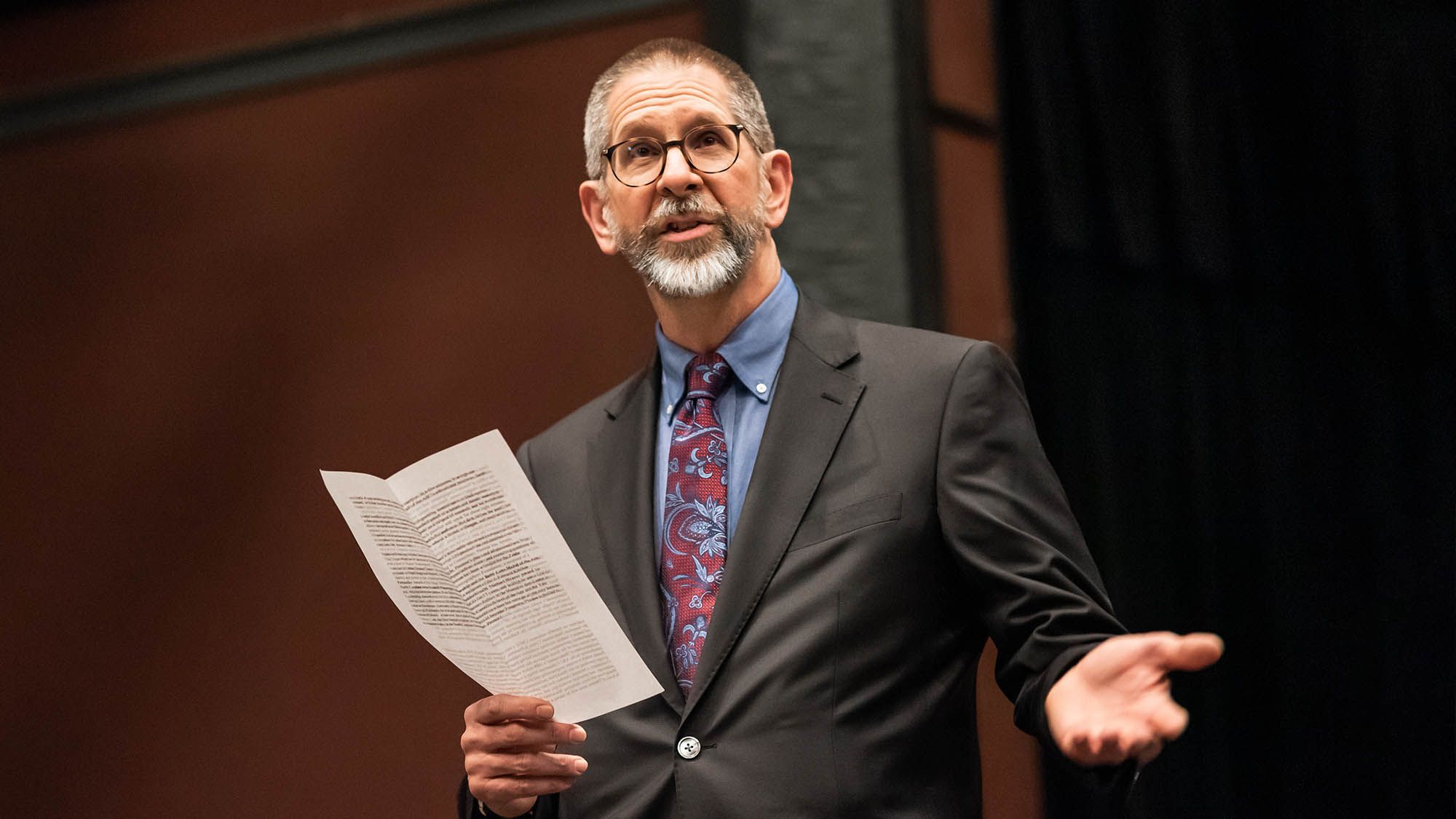 Professor Hodgkins presents his work at an academic event.