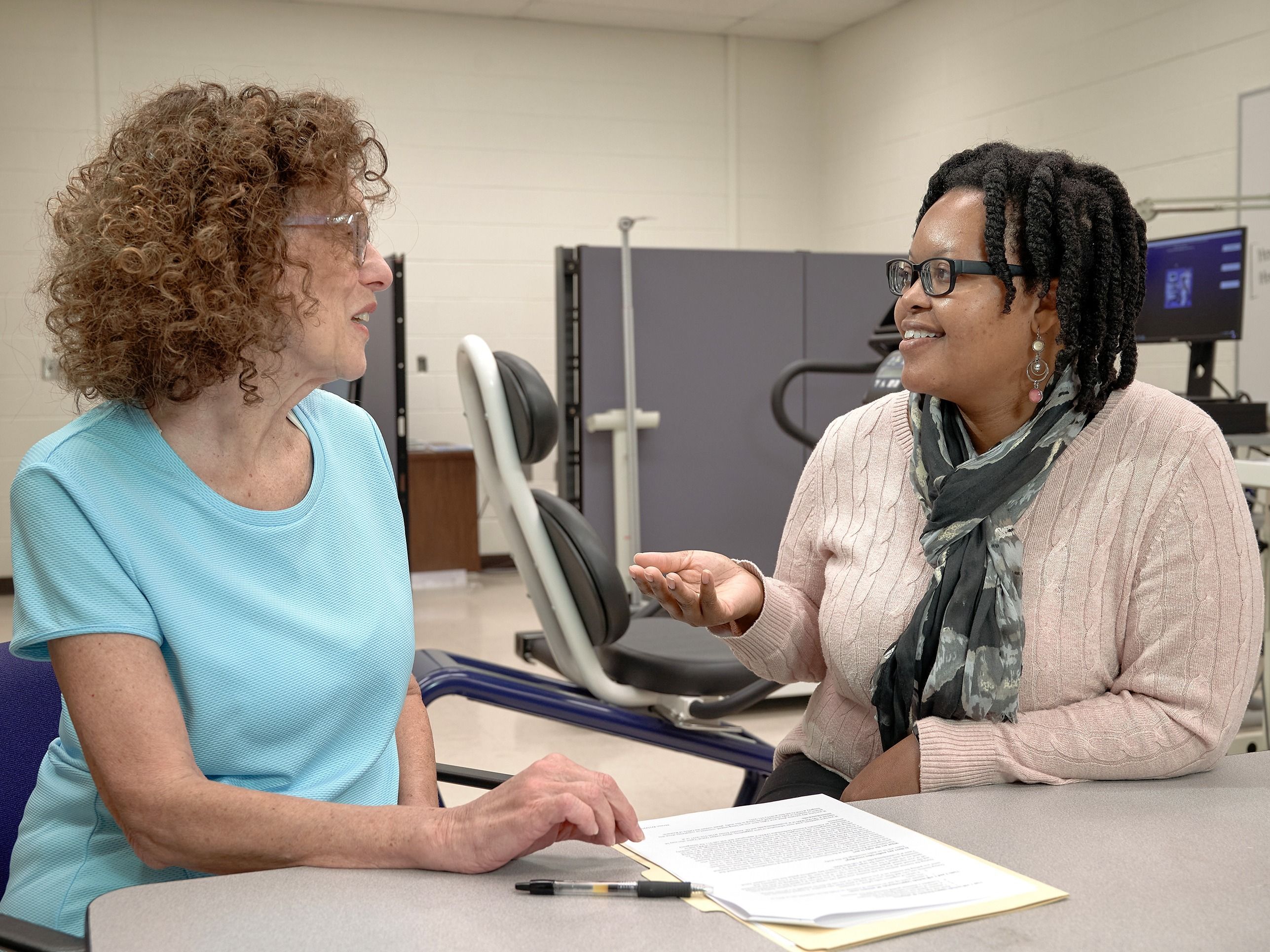 Shonda Mobley talks through a questionnaire with a research participant.