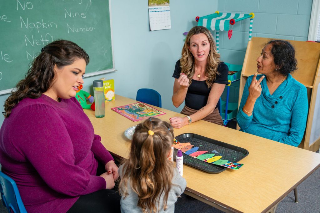 Ramesh and Flynt work with a student