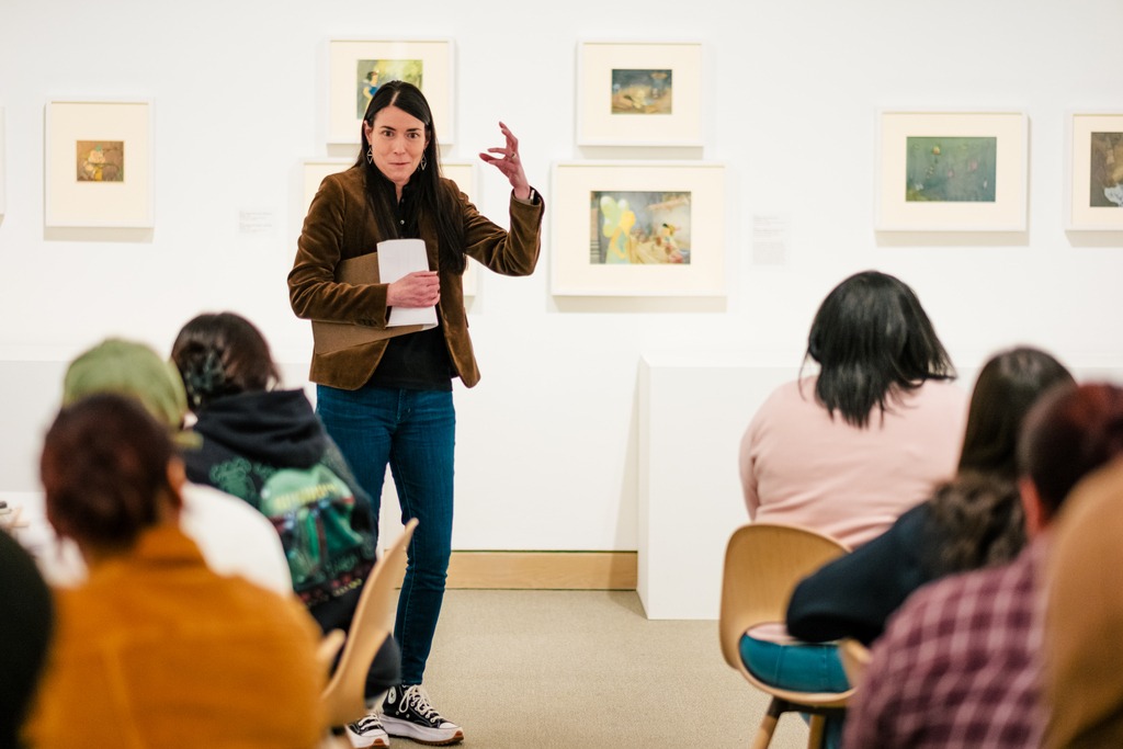 Dr. Heather Holian teaching animation to students using Weatherspoon Art Museum's Disney Animation Exhibit