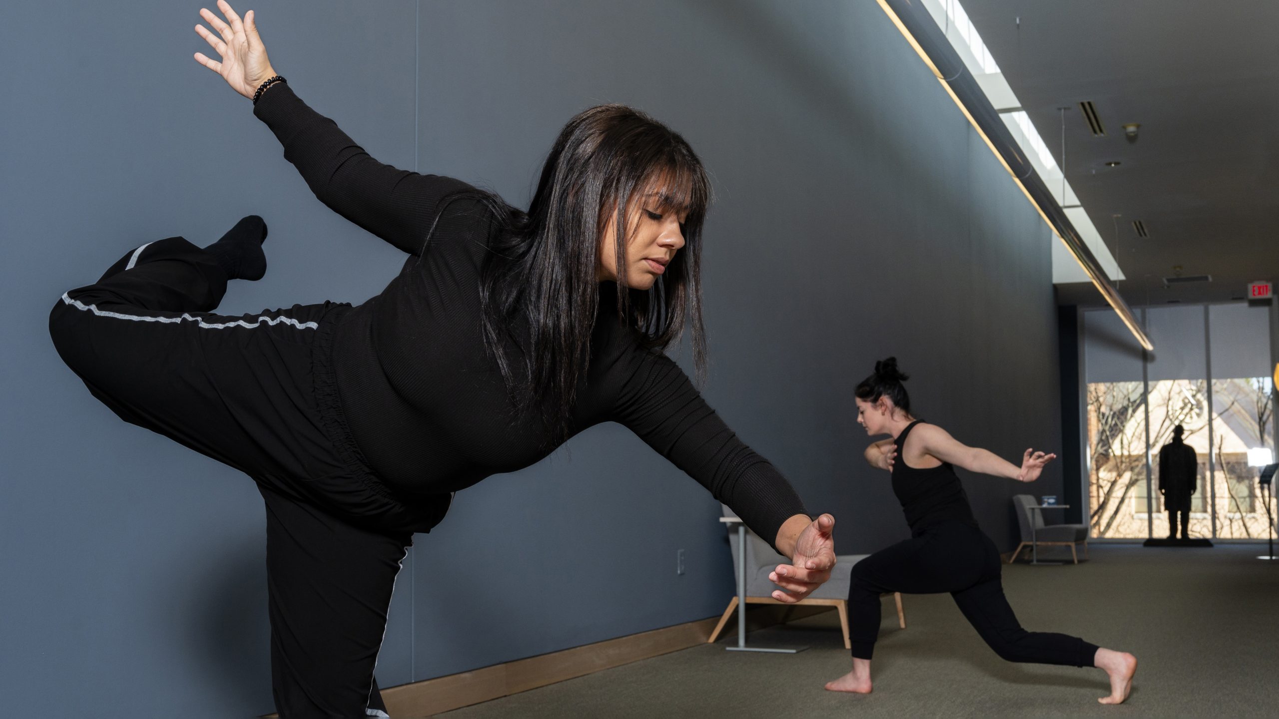 Liz Anderson and Tiffany Hale dancing at their exhibit