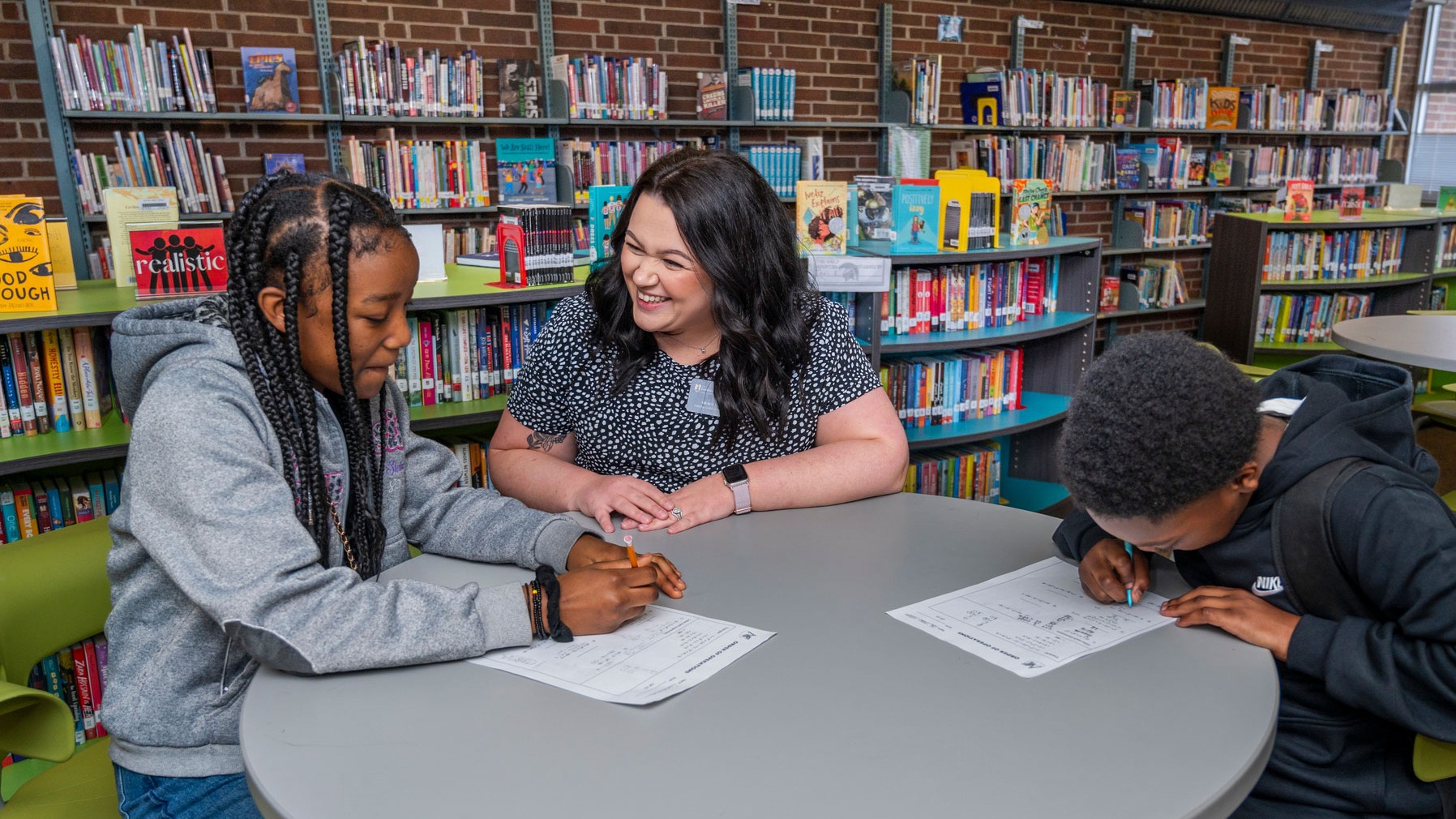 Grace Finn working with elementary students
