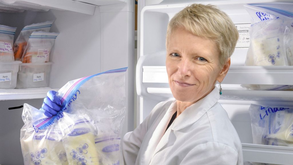 UNCG researcher Dr. Maryanne Perrin holds a bag with several donor milk samples in it