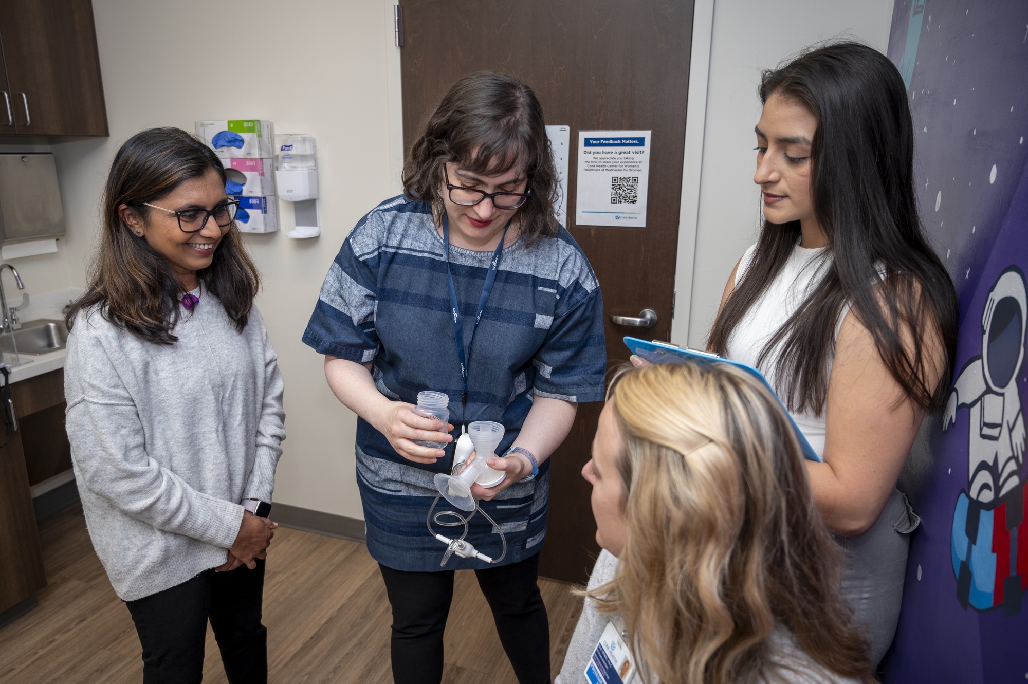 Dr. Jigna Dharod and Dr. Jasmine DeJesus are implementing an NIH-funded intervention to reduce obesity risk among Latine infants by supporting parents in breastfeeding. Here they meet with Cone Health collaborator Dr. Marjorie Jenkins and Julie Wenzel at the MedCenter for Women, where they will recruit participants for their pilot project.