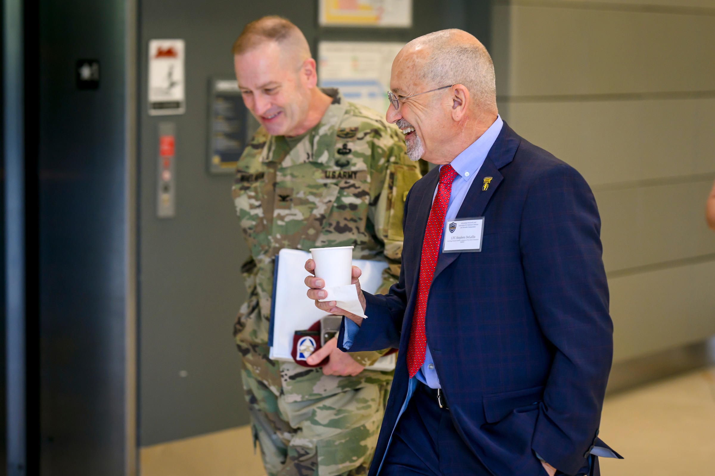 Wideman next to the Bod Pod, a machine that takes measurements of a child's body