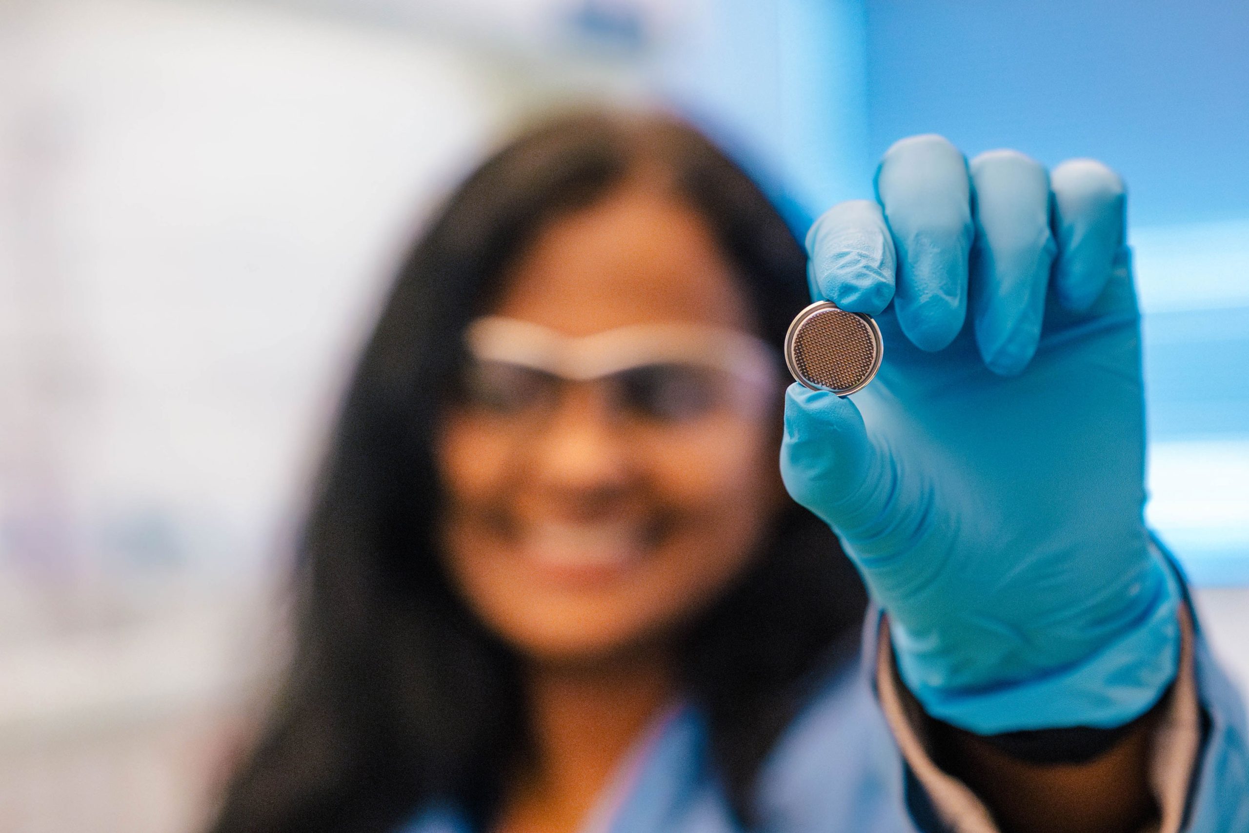 Wideman next to the Bod Pod, a machine that takes measurements of a child's body