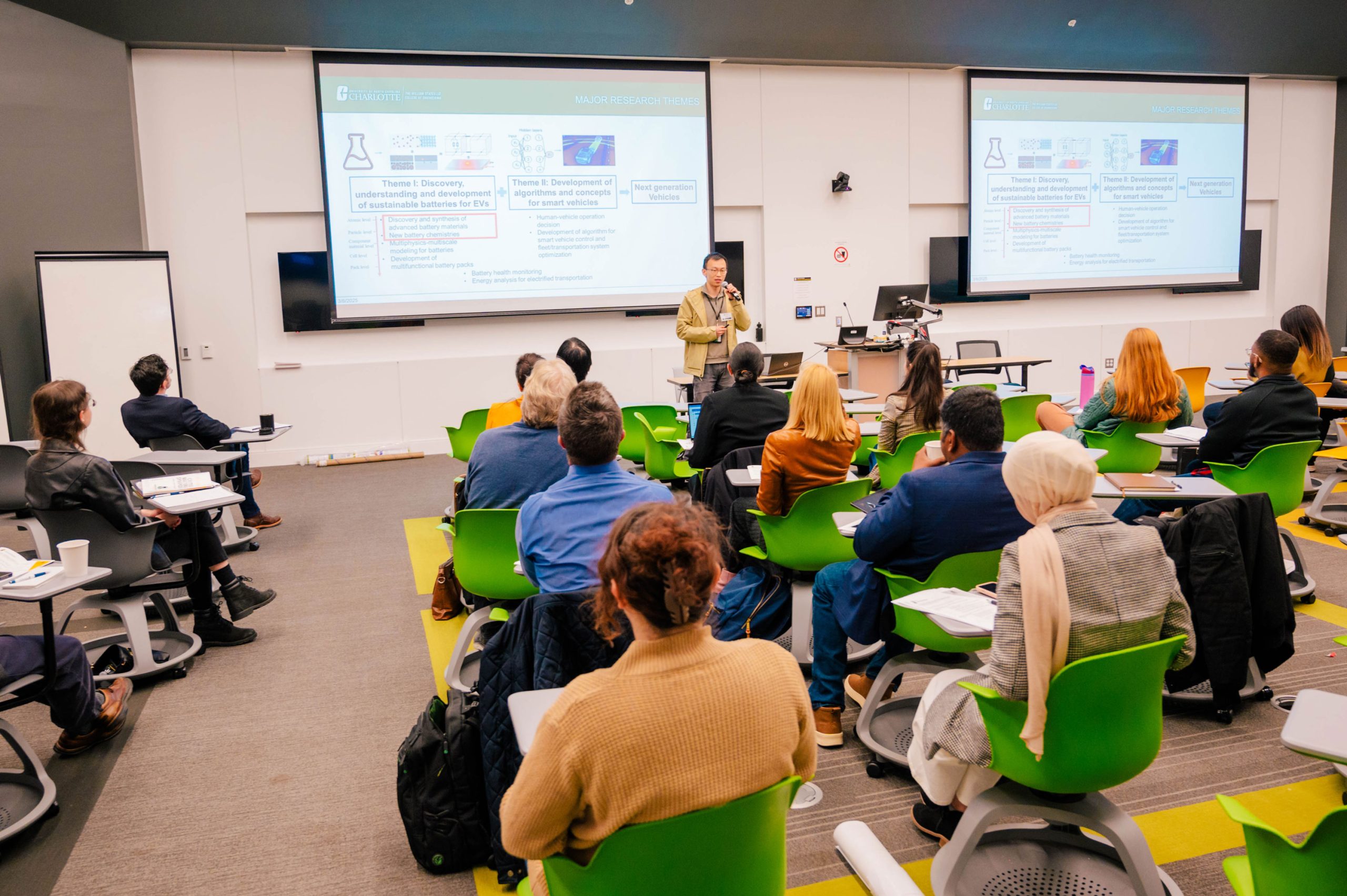 Wideman next to the Bod Pod, a machine that takes measurements of a child's body